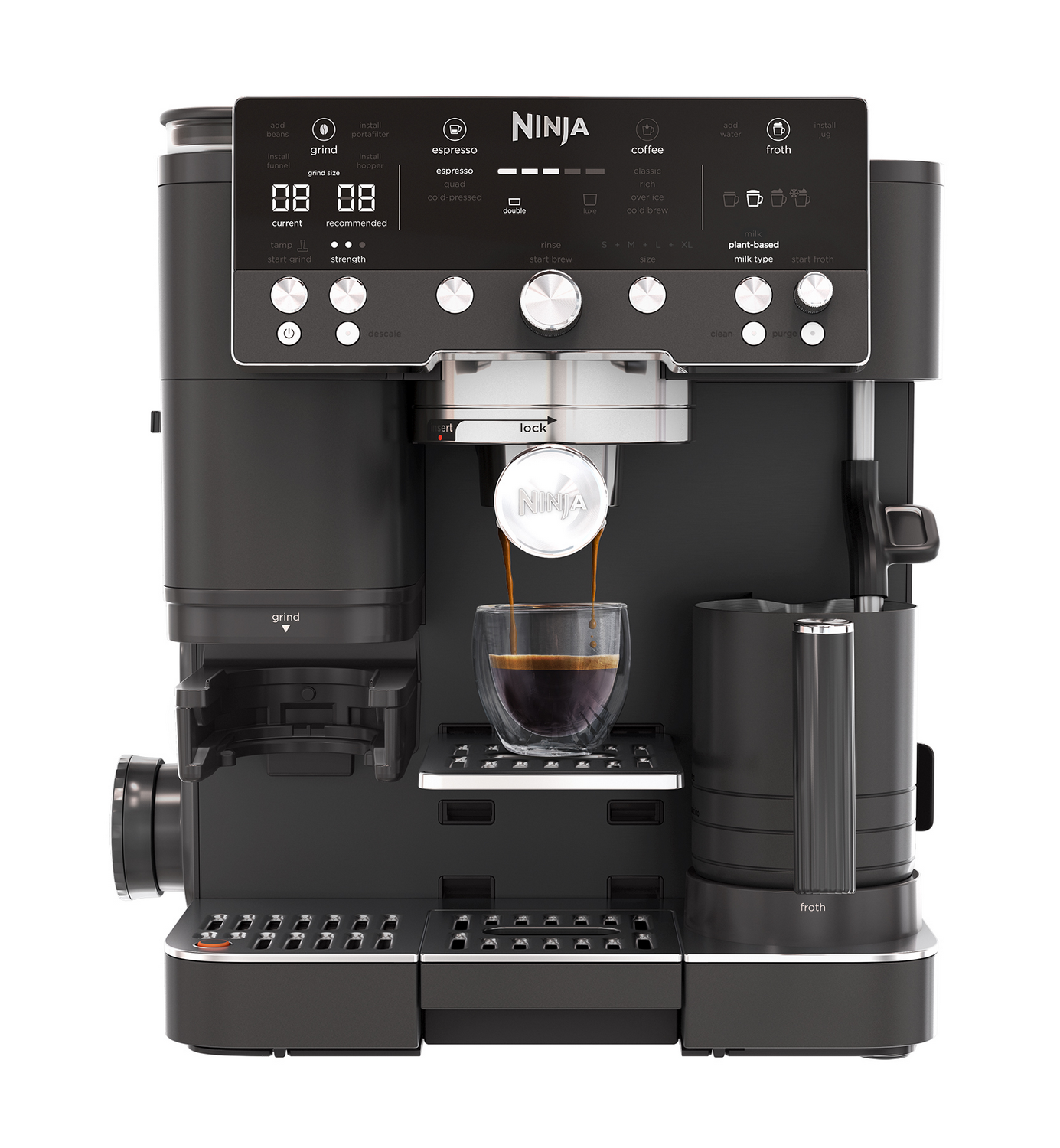 Cafetera Ninja negra preparando espresso en un vaso, con jarra espumadora adjunta.