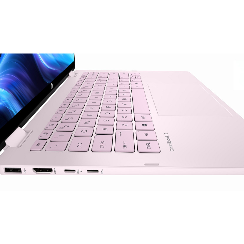Un ordinateur portable rose avec clavier et pavé tactile est montré sur fond blanc.