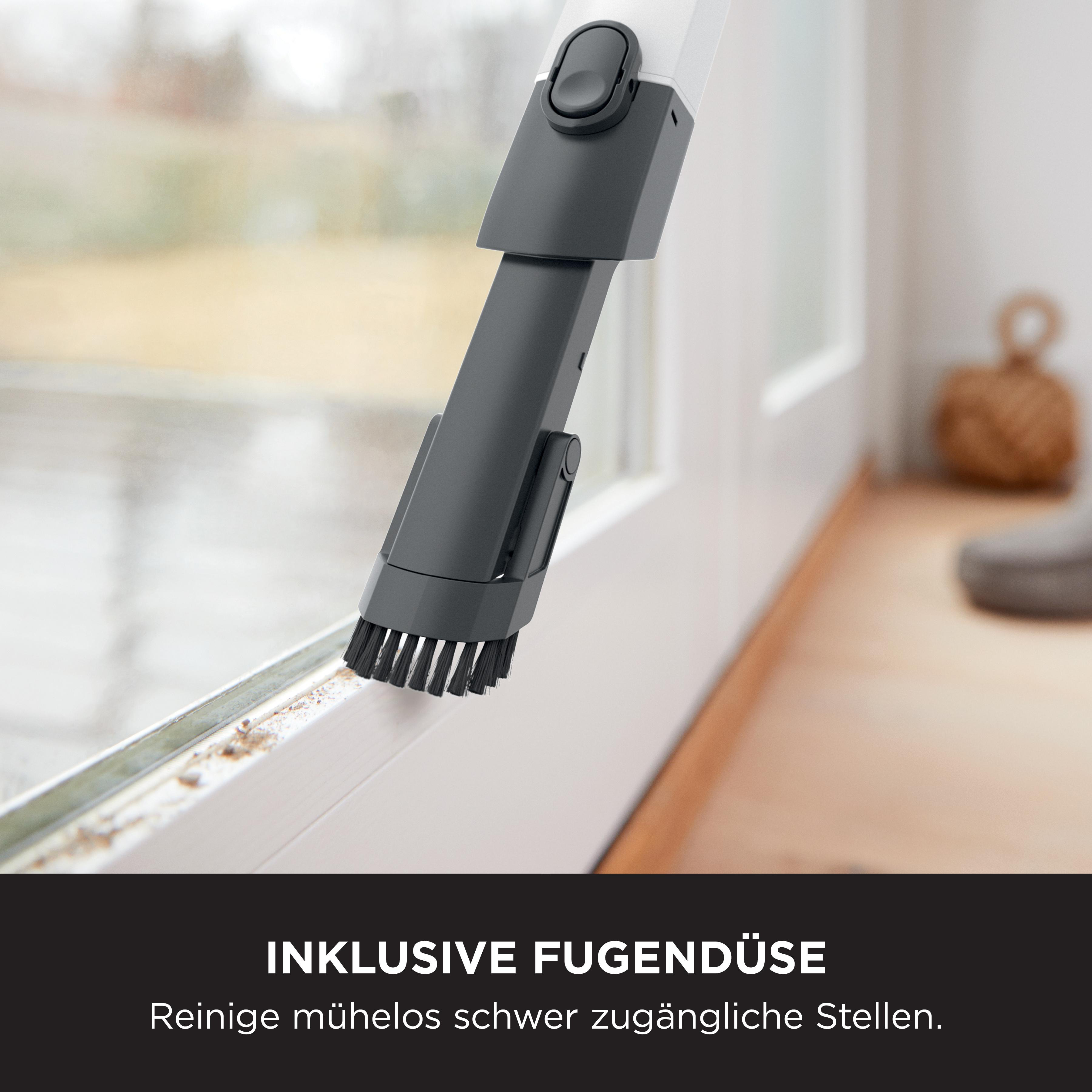 Staubsaugerdüse reinigt schmale Spalten mit Borsten.