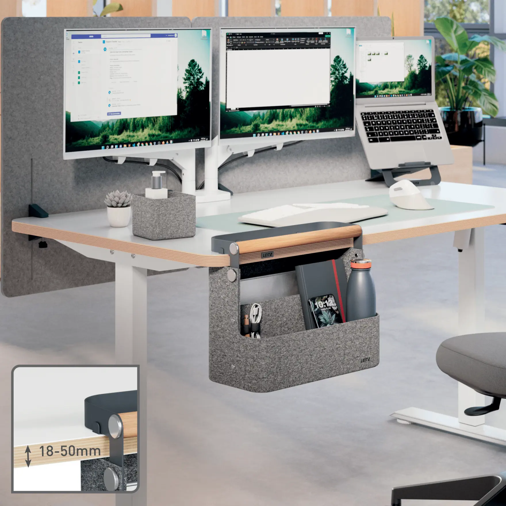 Íróasztal dupla monitorokkal, laptop, tároló és növény. A közelkép a bilincses rögzítést mutatja.