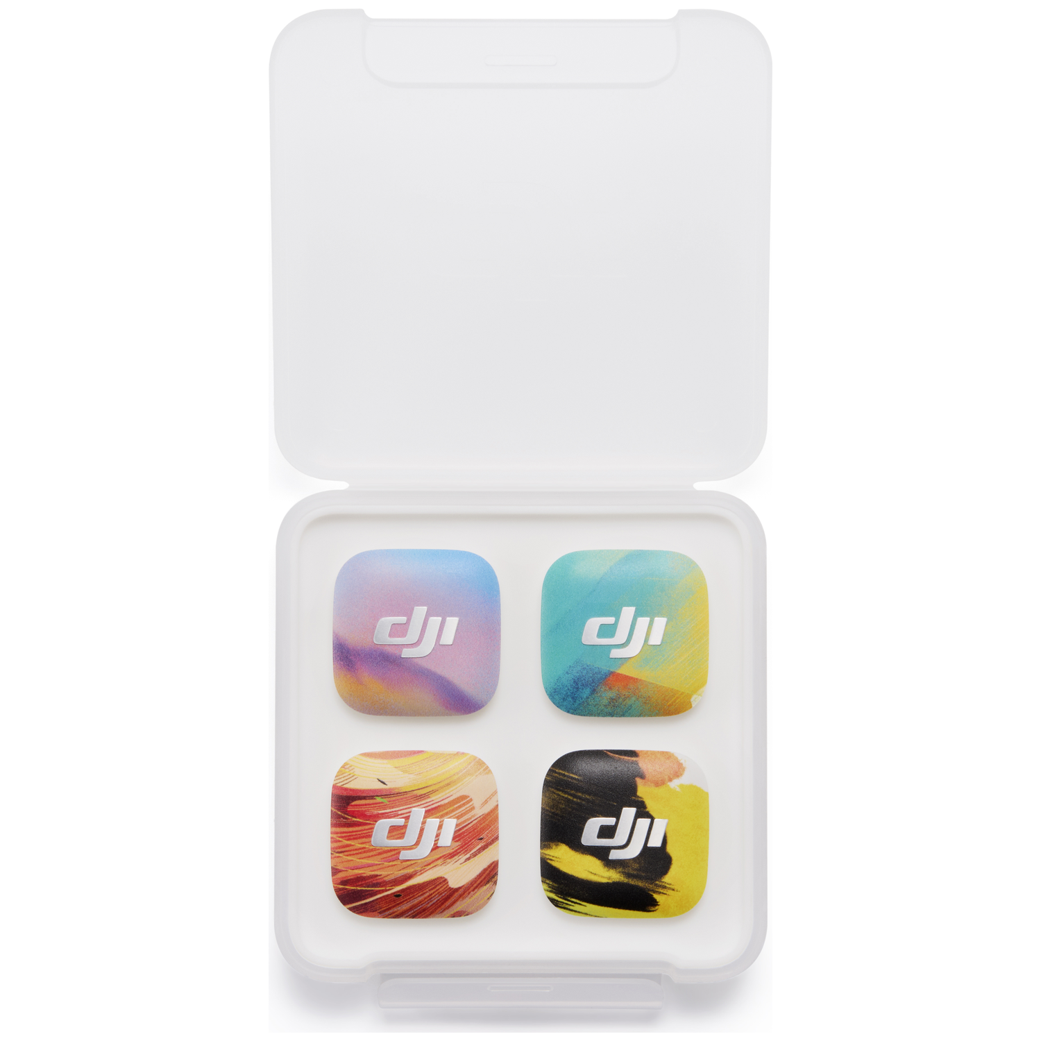 Vier DJI-stickers met kleurverlopen in een witte koffer.