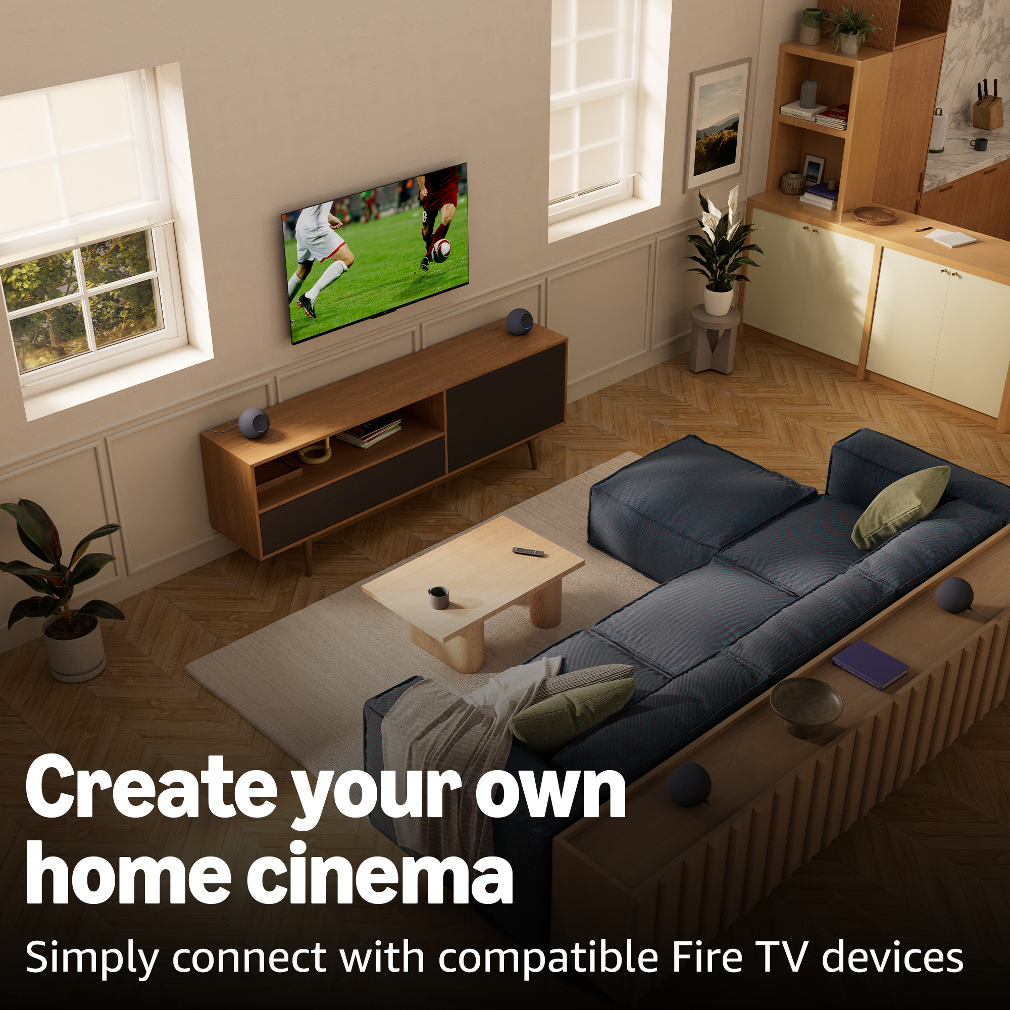 Modernes Wohnzimmer mit Sofa, Fernseher mit Fußball und Küchenzeile.
