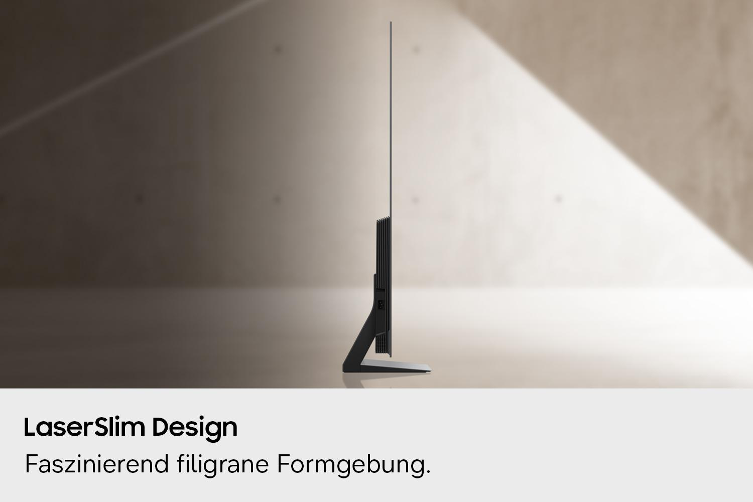 Ein schlankes, schwarzes Fernsehgerät mit Ständer, im Profil gezeigt.