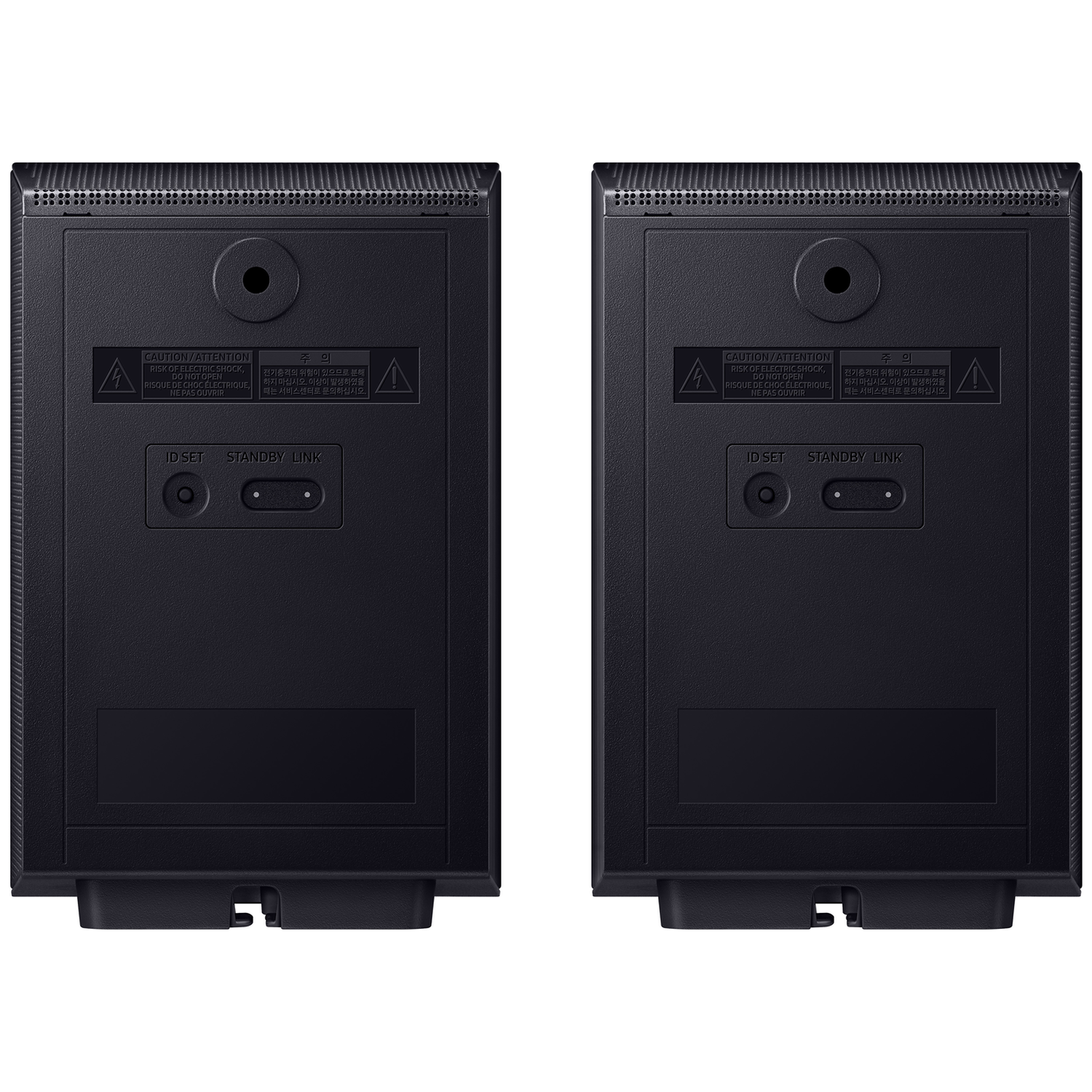 Back of two black speakers with warning labels and ports.