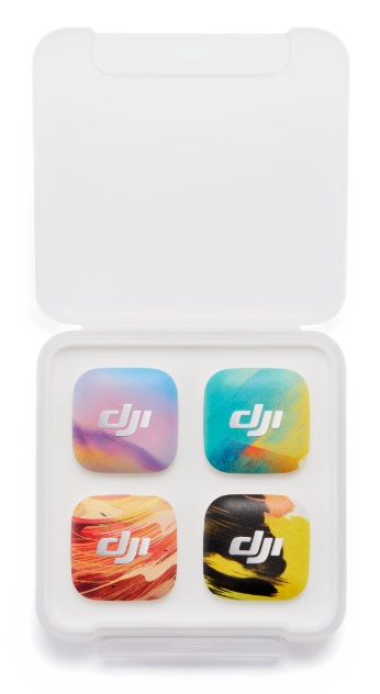 Cztery naklejki DJI w białym etui, z kolorowymi wzorami i logo DJI.