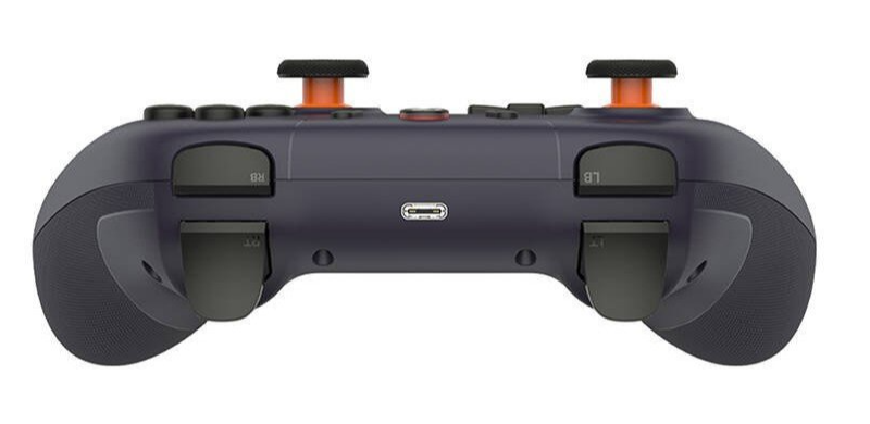 Ciemnoszary kontroler z pomarańczowymi akcentami, portem USB-C i oznaczeniami przycisków.