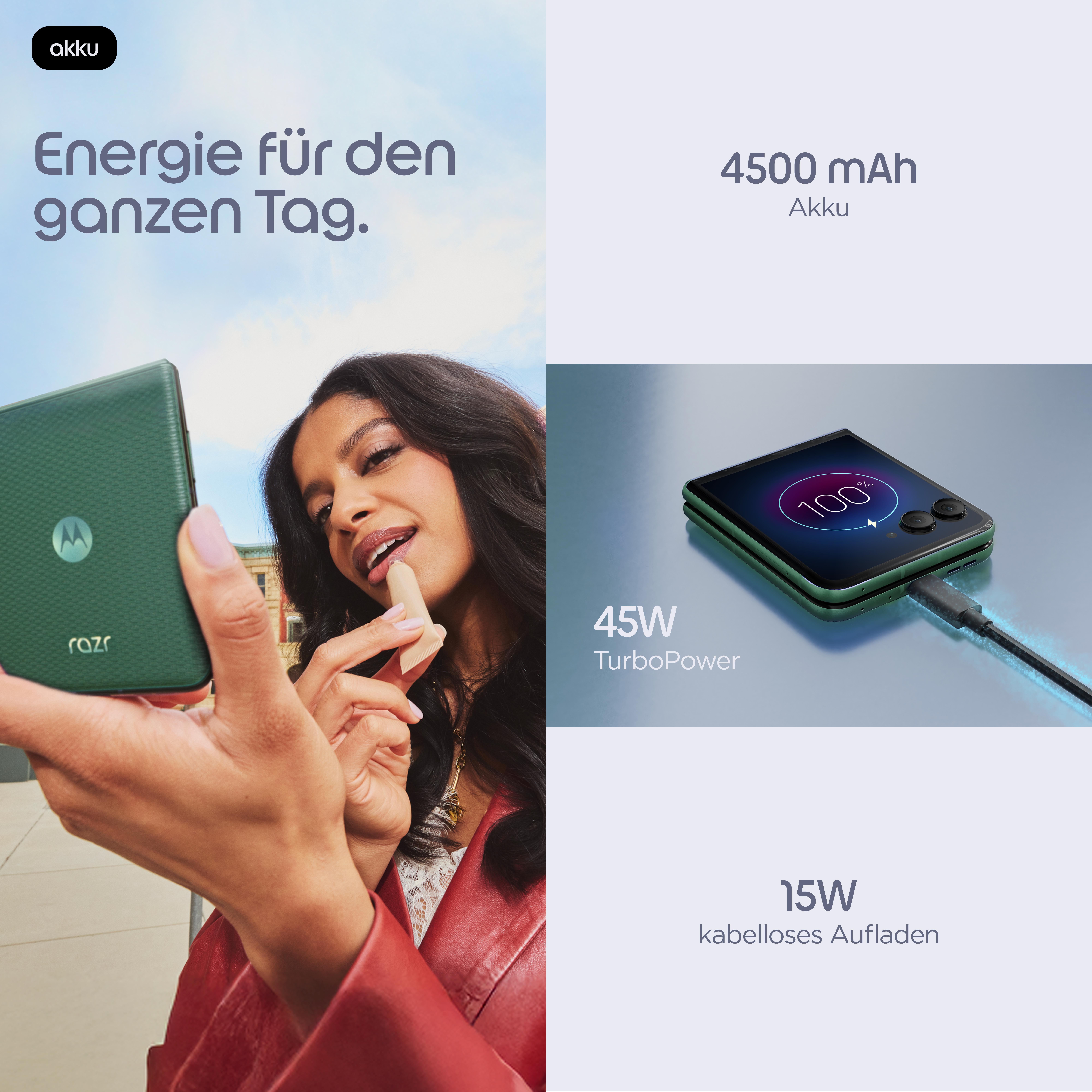 Eine Frau trägt Lippenstift vor einem grünen Motorola Razr Handy auf. Das Handy zeigt 100% Ladung.