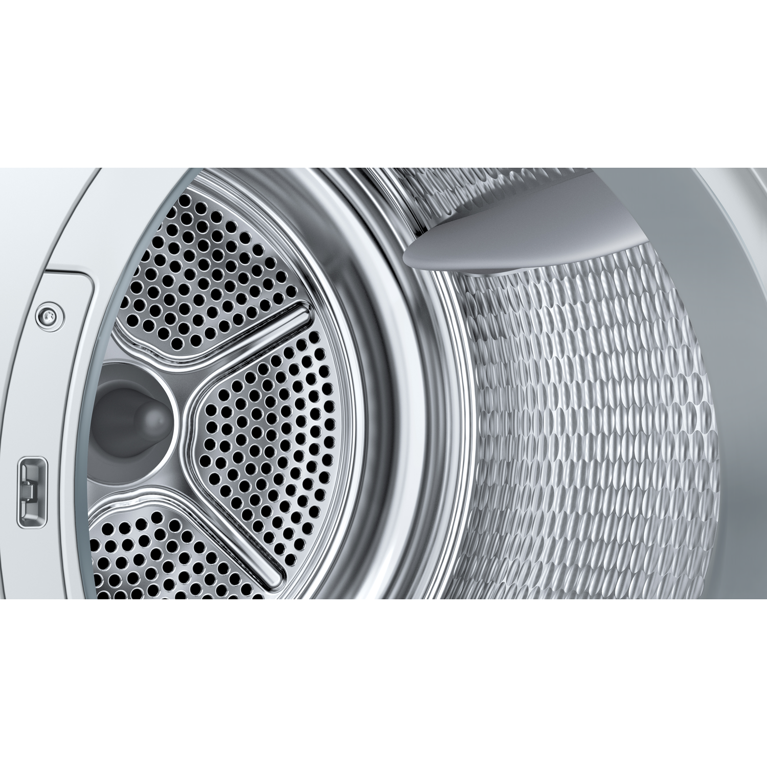 Close-up of a dryer drum with a perforated pattern and a textured surface.