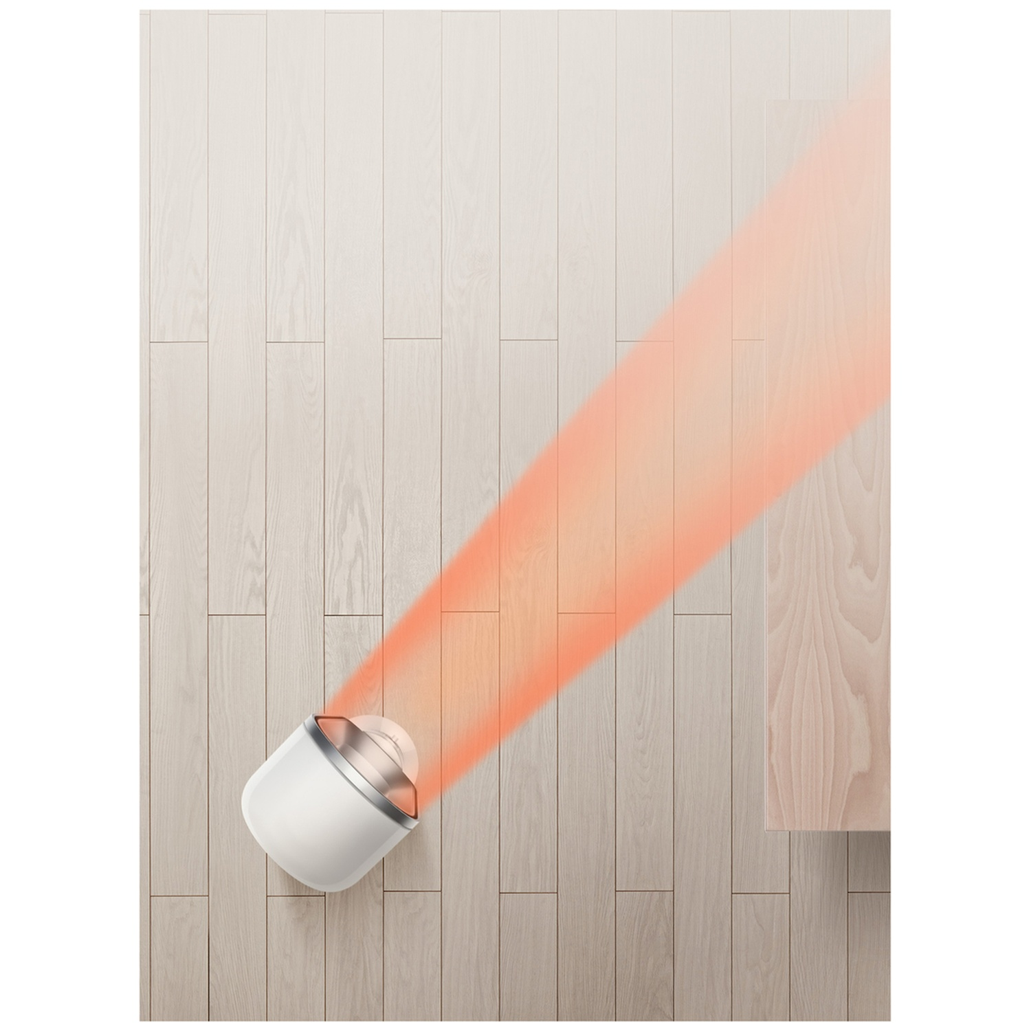 Een witte diffuser op een houten vloer zendt een rode lichtstraal uit.