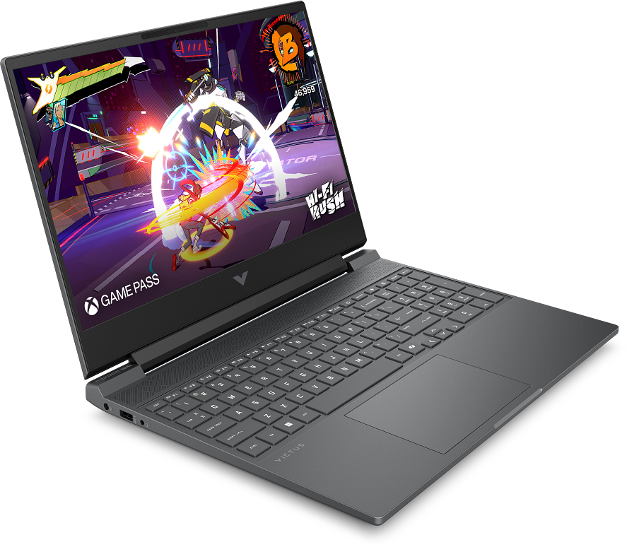 Egy nyitott laptop színes videojátékot mutat be, rajzfilmfigurákkal és robbanásokkal.