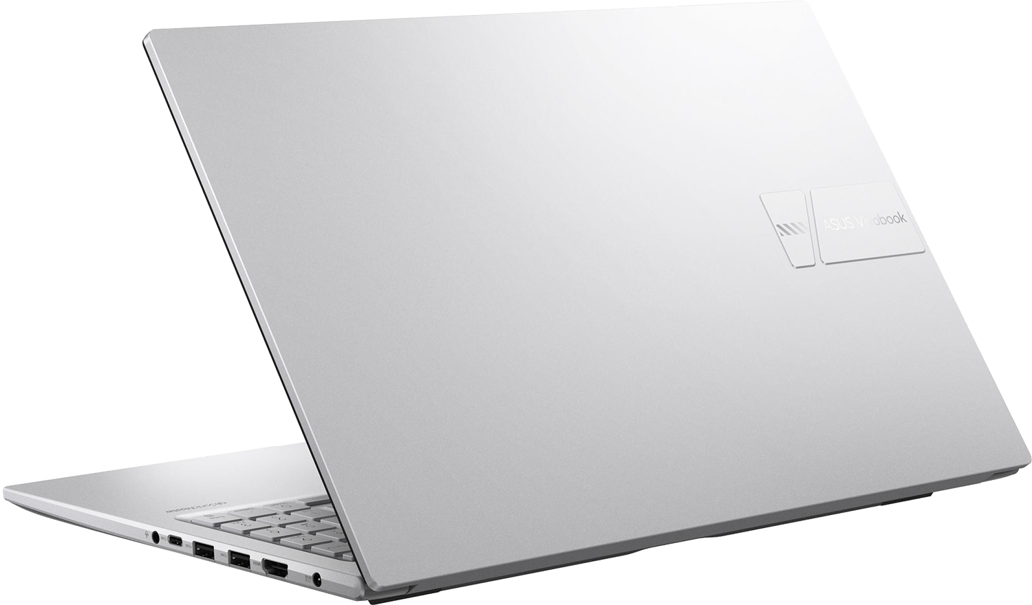 Egy ezüst színű Asus Vivobook laptop, enyhén ferdén hátulról, nyitott fedéllel.