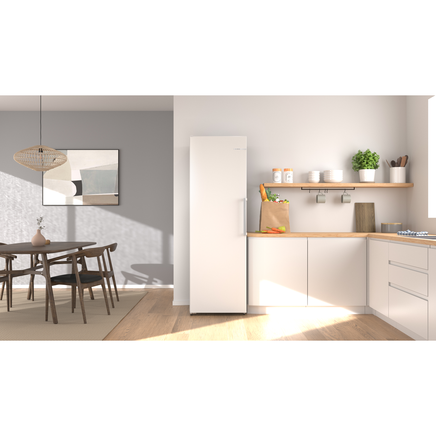Modern kitchen with dining area. White fridge, wooden table, chairs, abstract art.