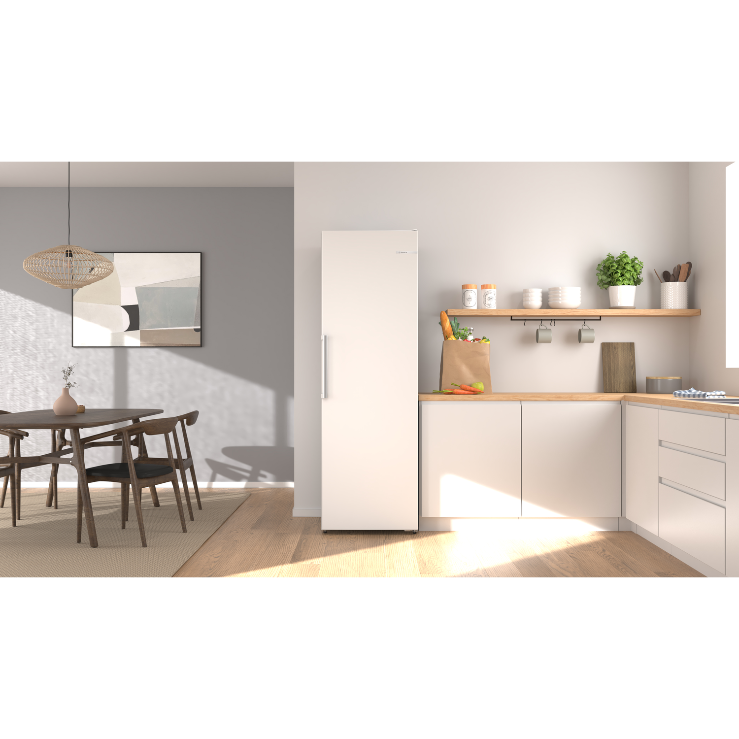 Modern kitchen with dining area. White appliances, wood surfaces, and minimalist art.