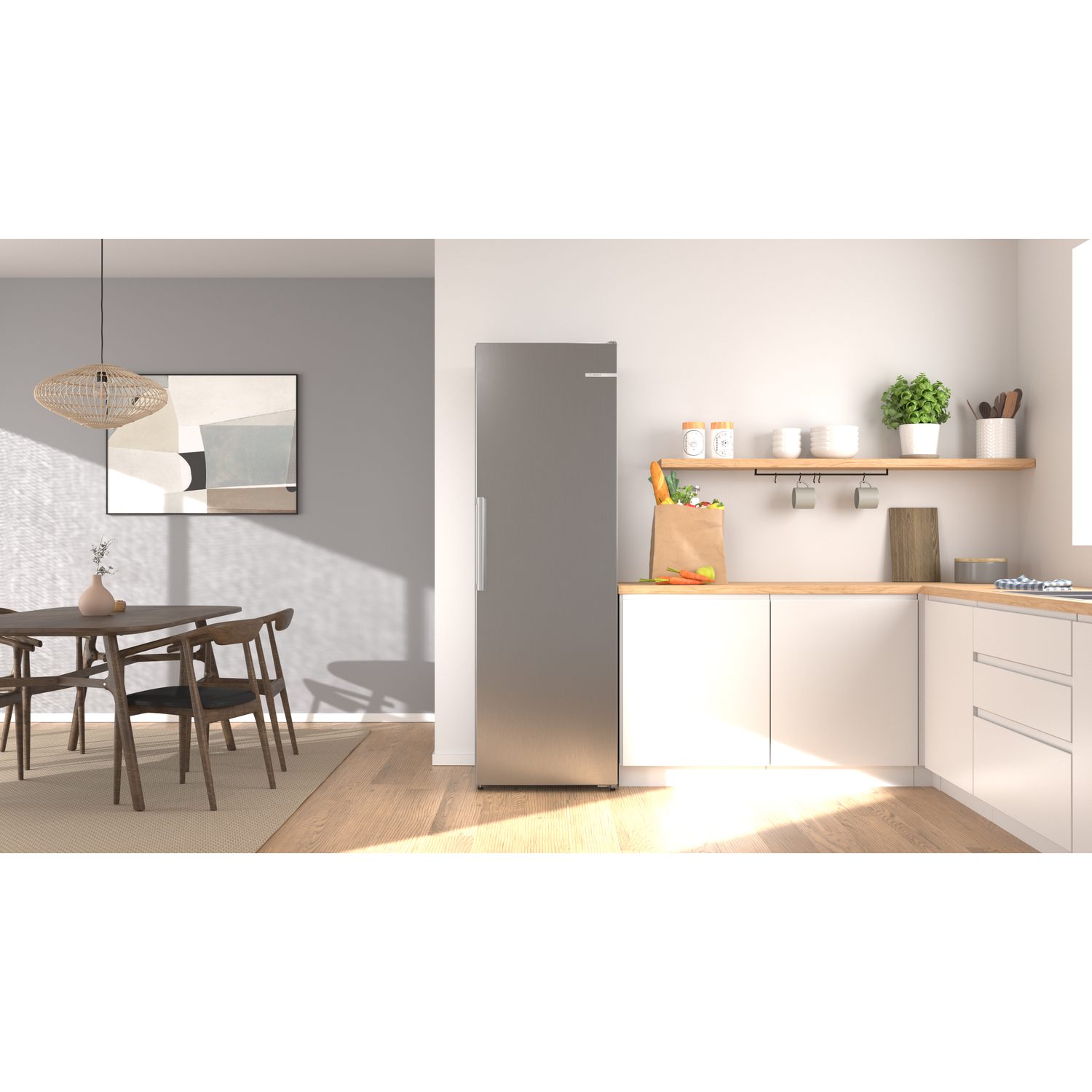 Modern kitchen with dining area. Silver fridge, white cabinets, wooden table, chairs.