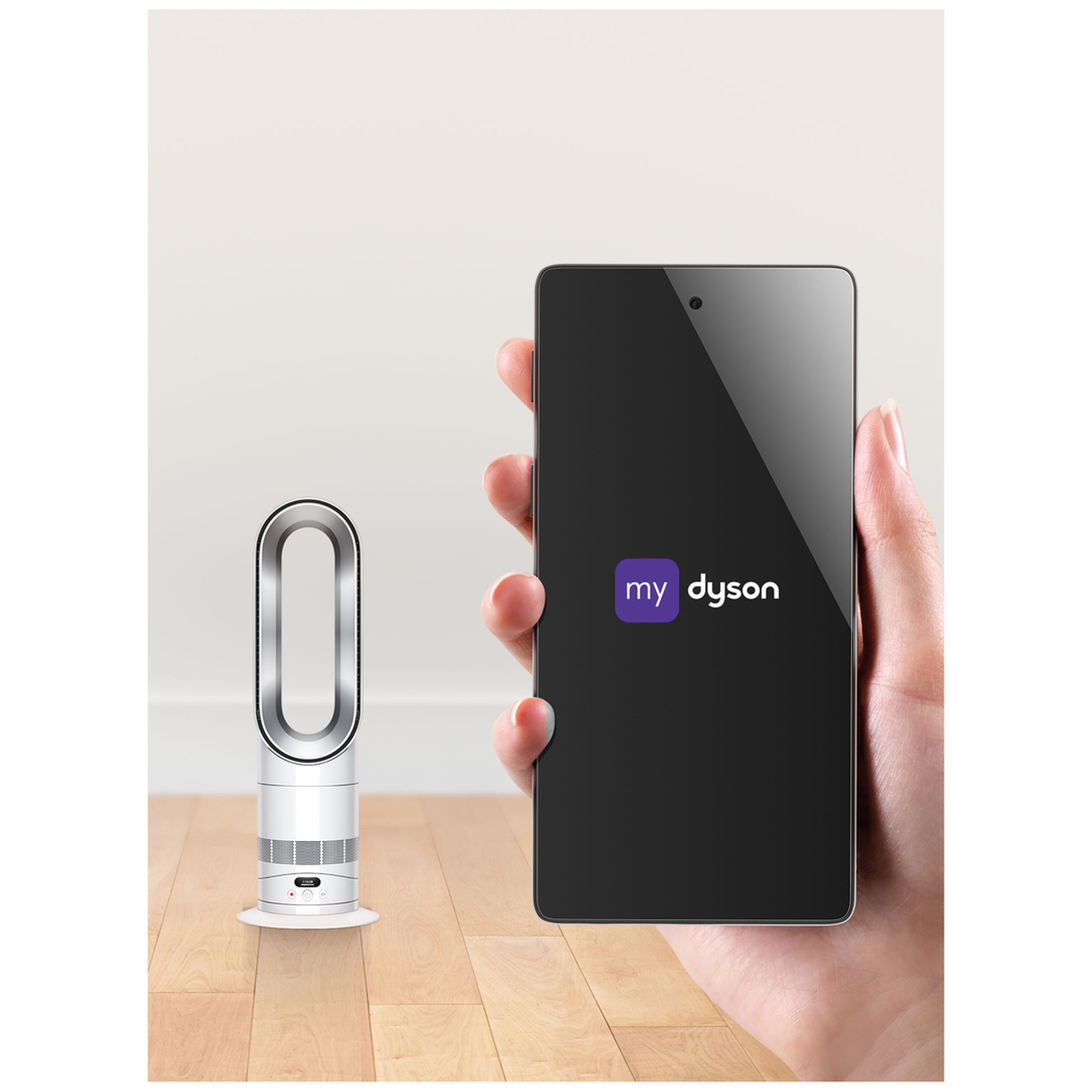 A white Dyson fan stands next to a smartphone displaying the Dyson app.