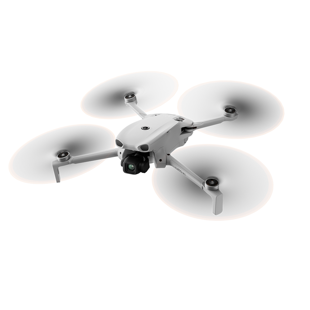 Dört pervaneli beyaz bir drone siyah arka plana karşı süzülüyor.