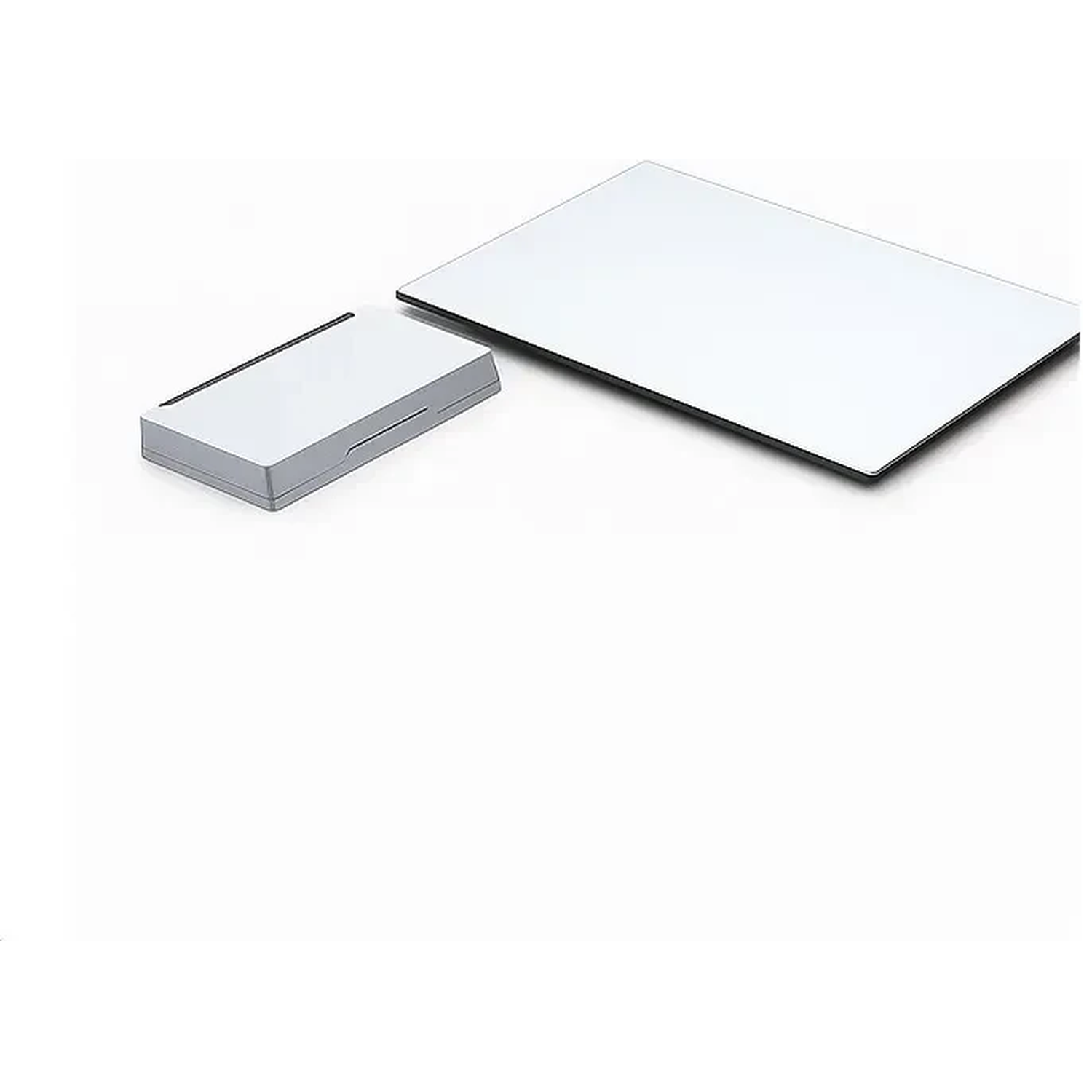 A white rectangular object sits next to a white and silver oblong object.