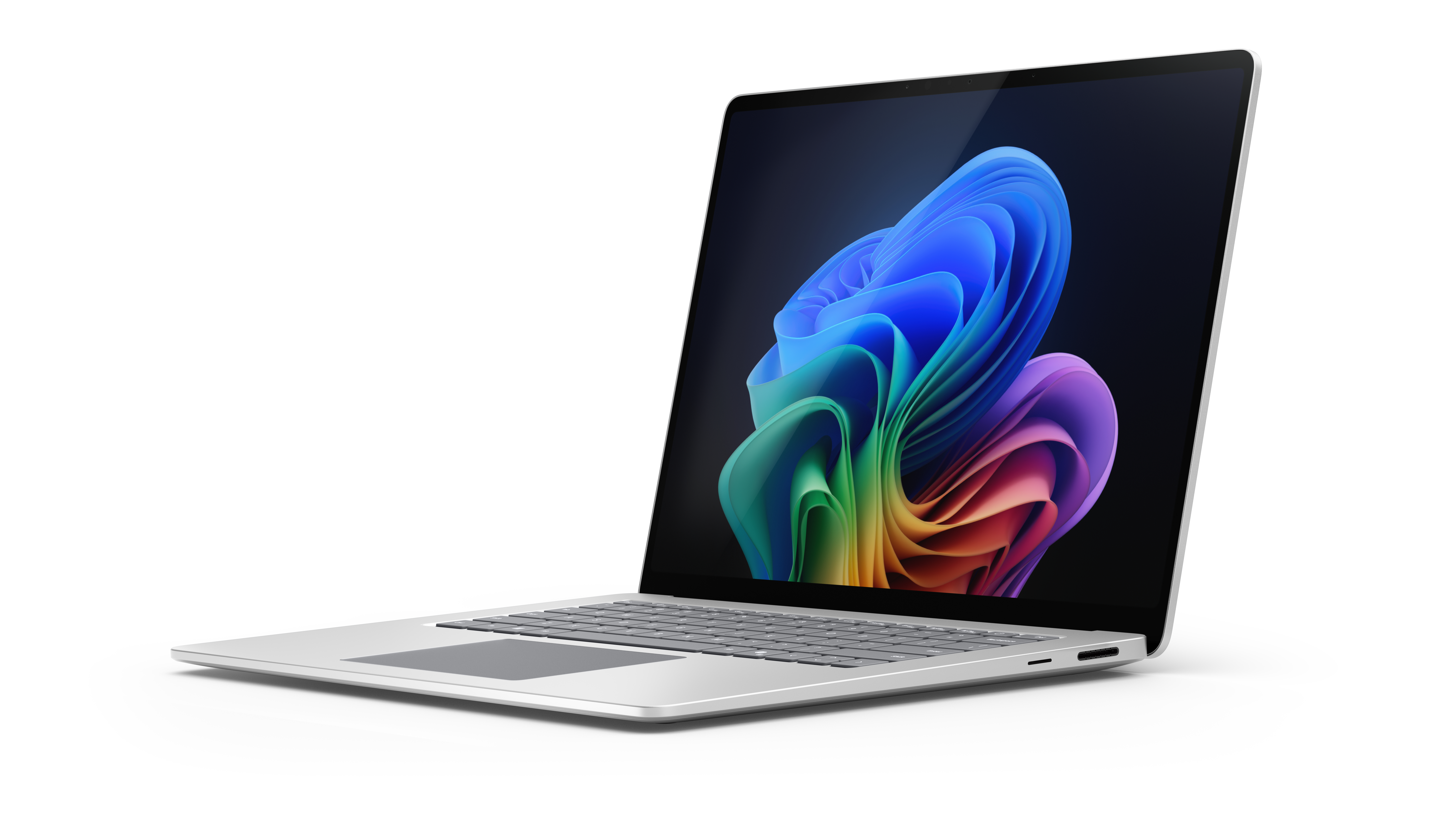 Ein geöffneter silberner Laptop mit einem bunten, abstrakten Hintergrundbild.