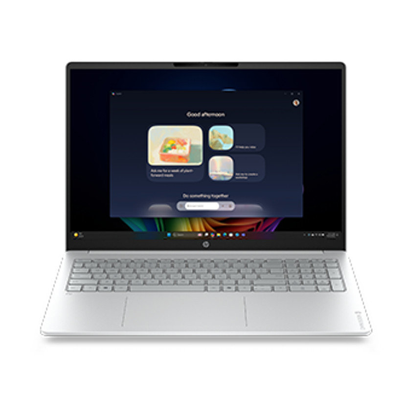 Srebrny laptop HP wyświetla ekran „Dobrego popołudnia” z kolorowymi grafikami i ikonami.
