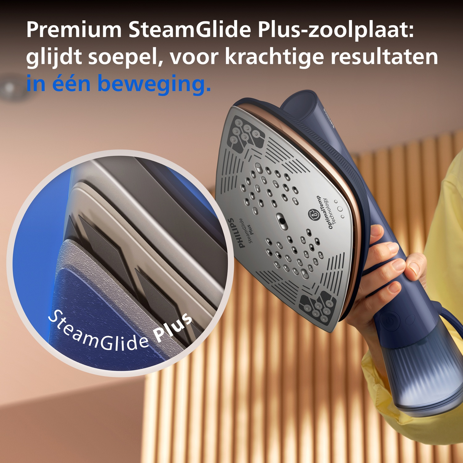 Steam iron with SteamGlide Plus sole and material close-up.
