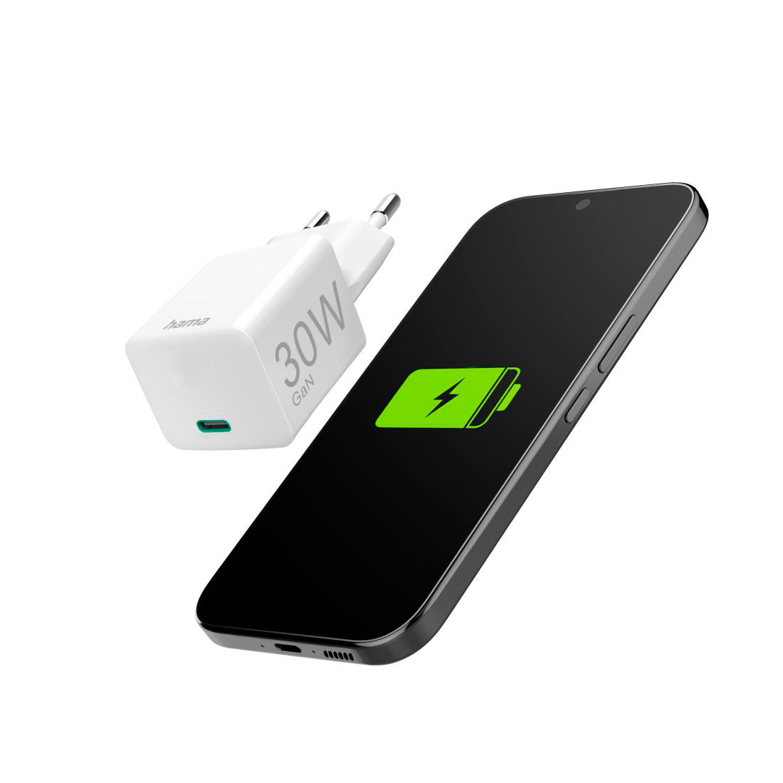 Ein weißer 30W GaN-Ladestecker liegt neben einem Smartphone mit einem grünen Ladesymbol.