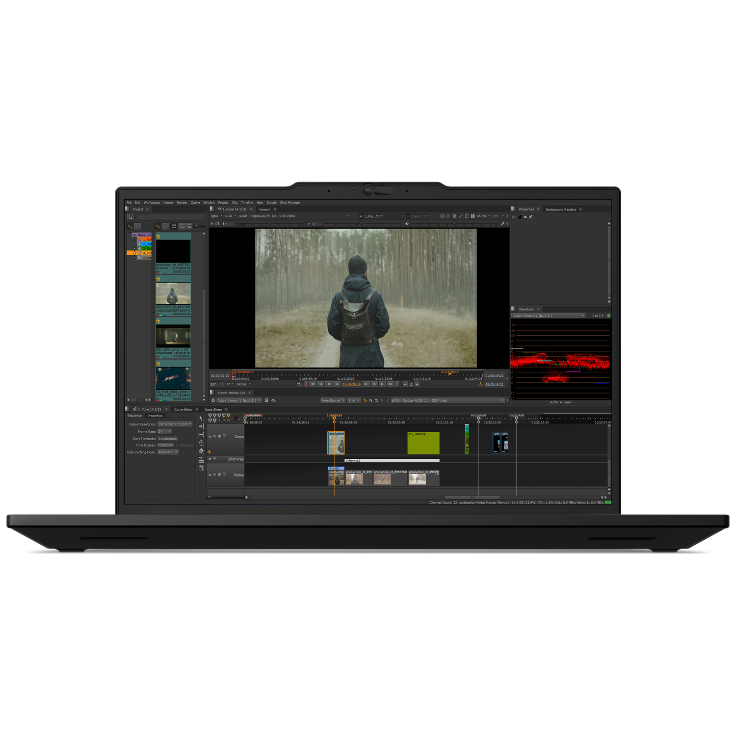 A laptop displays video editing software with a man in a forest on screen.
