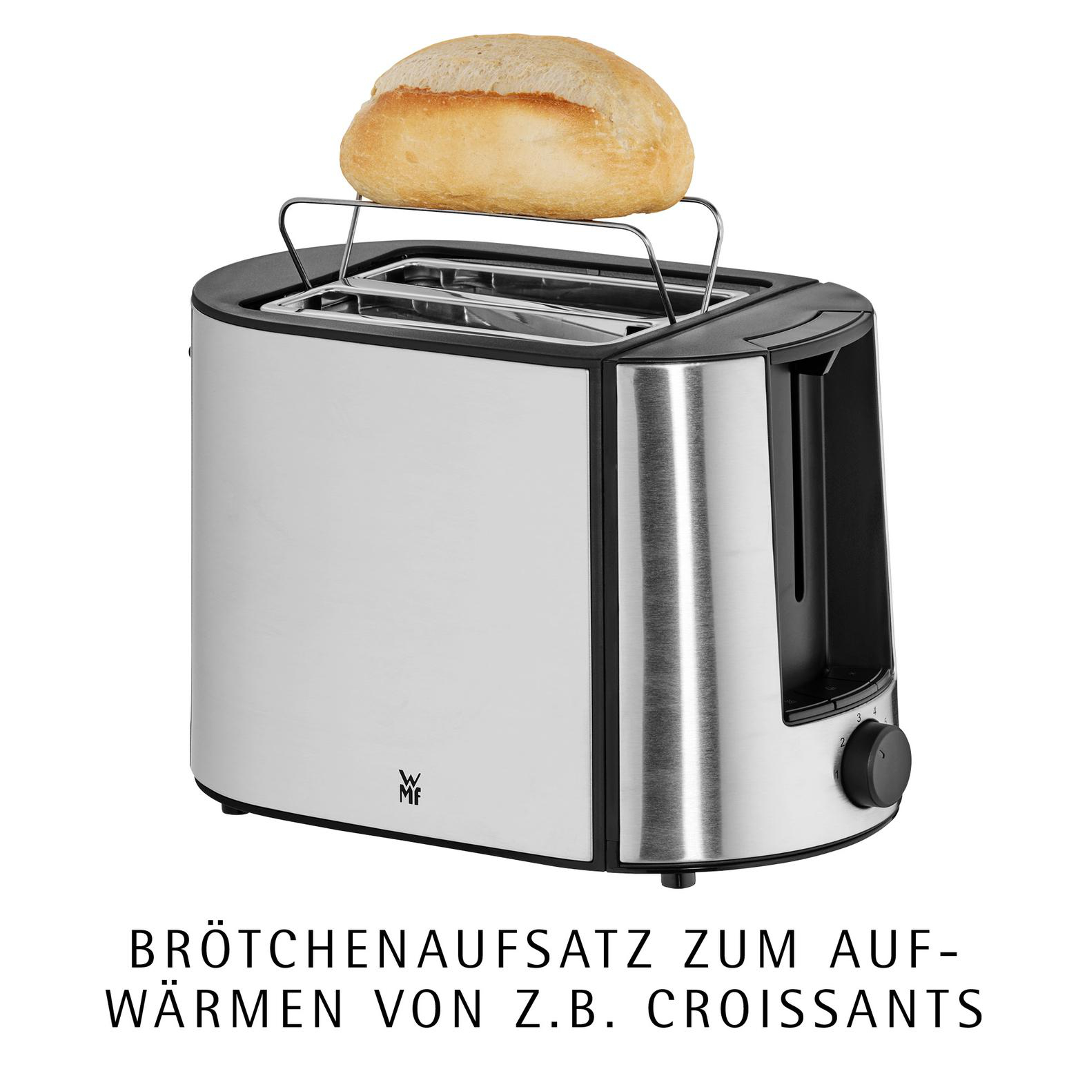 Ein silberner Toaster mit Brötchenaufsatz und einem Brötchen darauf.