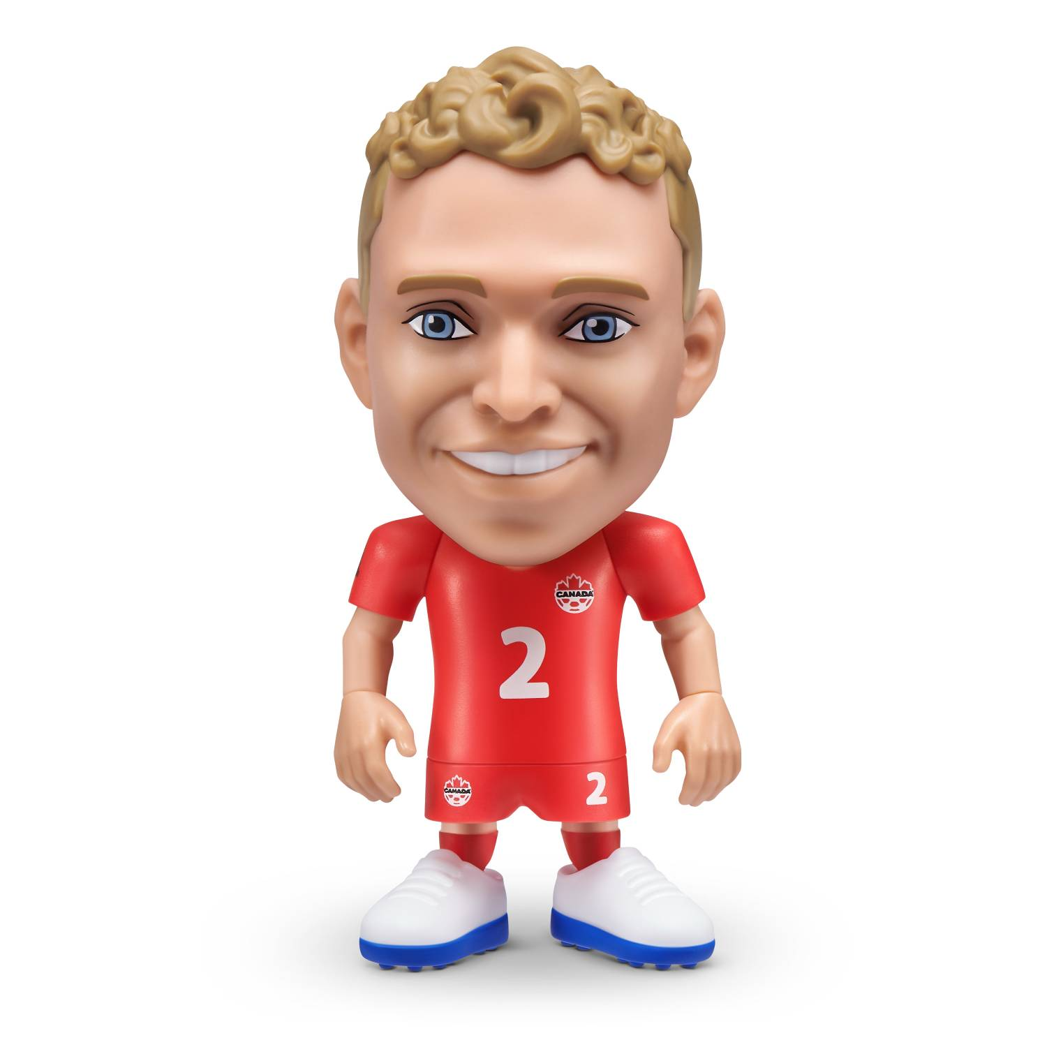 Una figura de juguete de futbolista en rojo con el número 2 y un logo de Canadá.