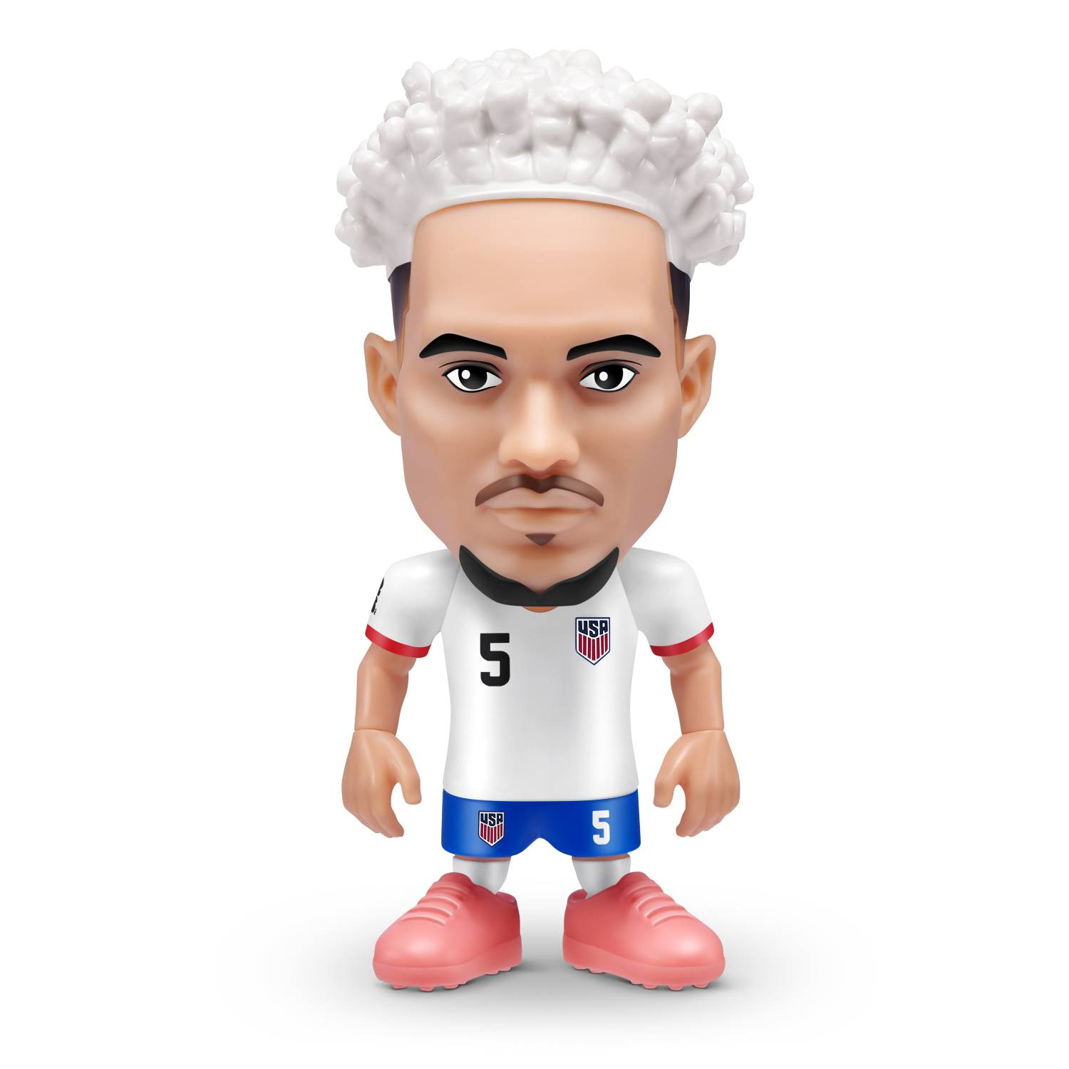 Figura de futbolista con pelo blanco, camiseta blanca con el número 5 y pantalones azules.