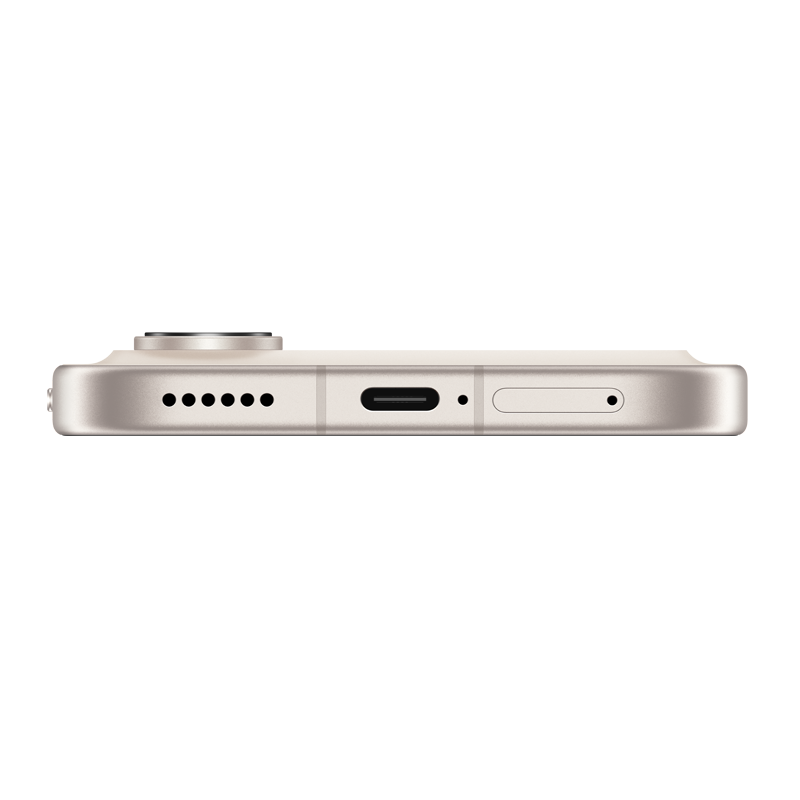 Borde inferior de un smartphone dorado claro mostrando altavoz, puerto USB-C y bandeja SIM.