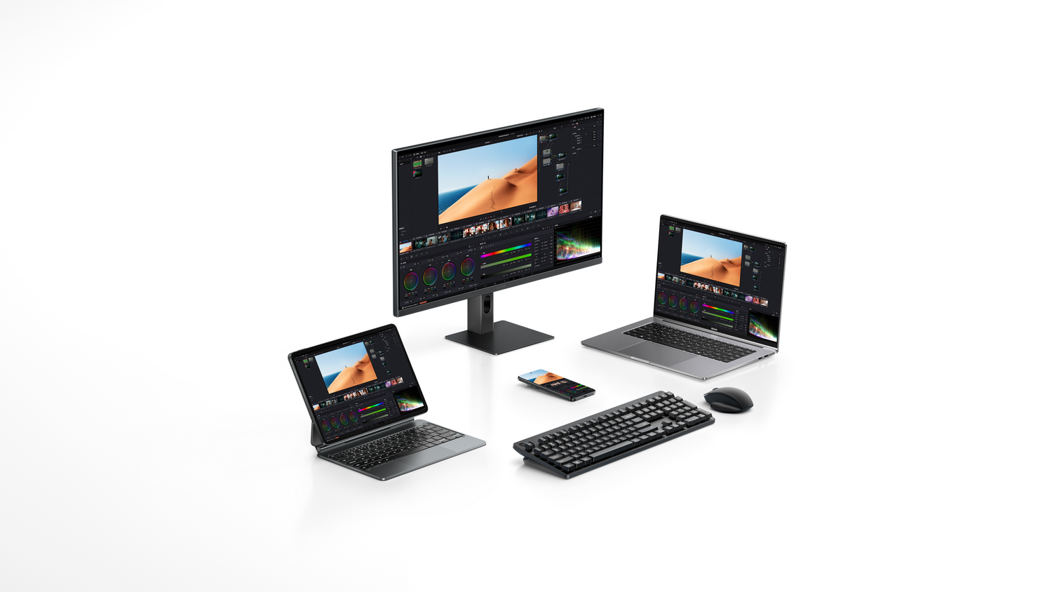 Un equipo de escritorio con un monitor grande, dos portátiles, una tablet, smartphone, teclado y ratón.