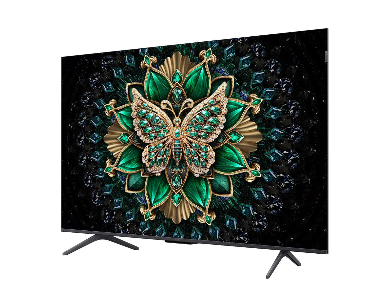 Un televisor muestra un patrón de mariposa, esmeraldas y oro.