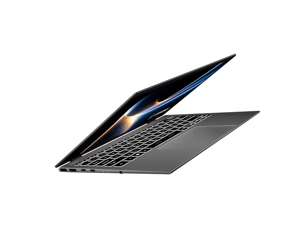 Ein grauer Laptop mit geöffnetem Deckel und beleuchteter Tastatur auf schwarzem Hintergrund.