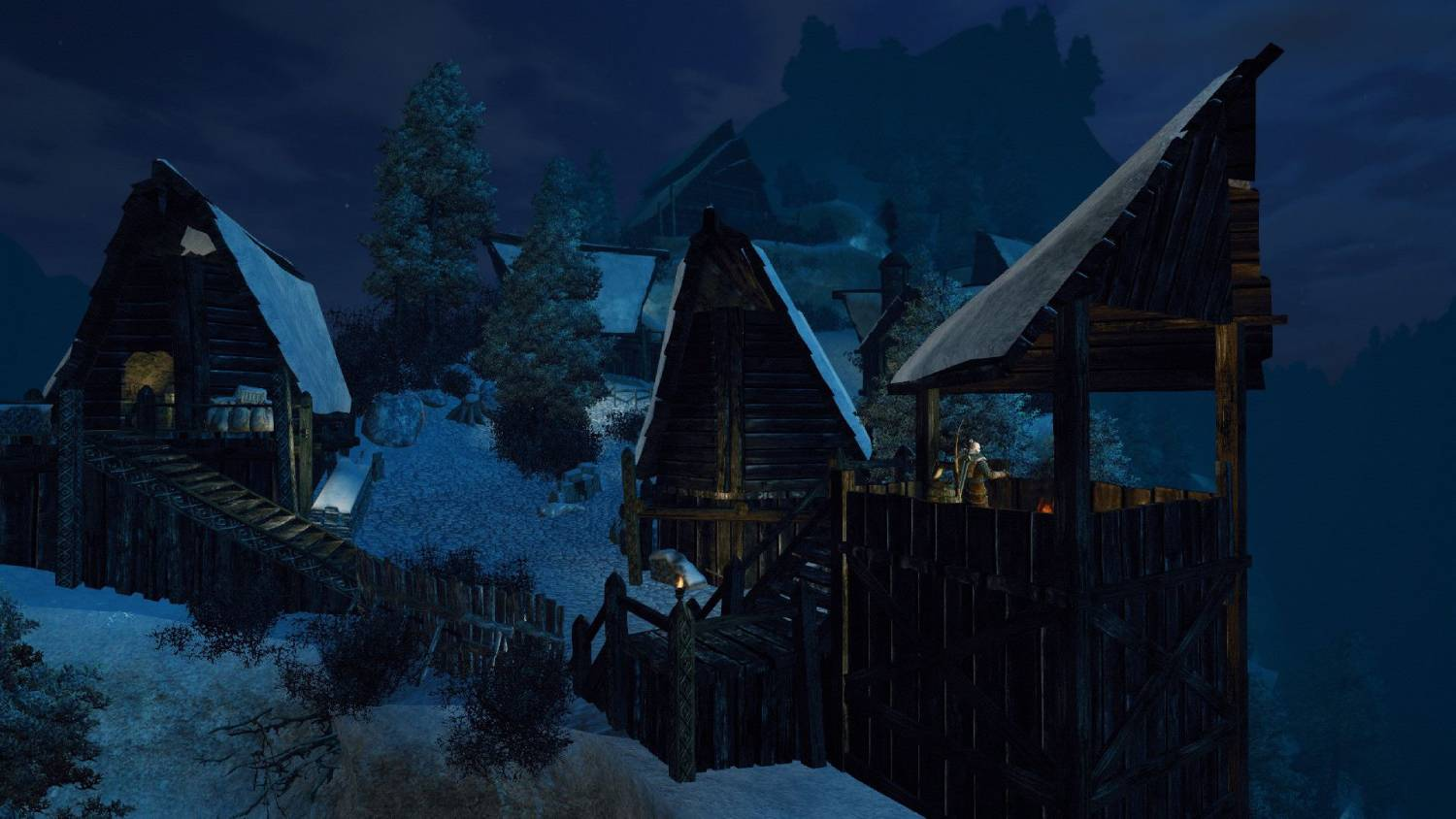 Escena de pueblo invernal nocturno con casas de madera y árboles nevados.