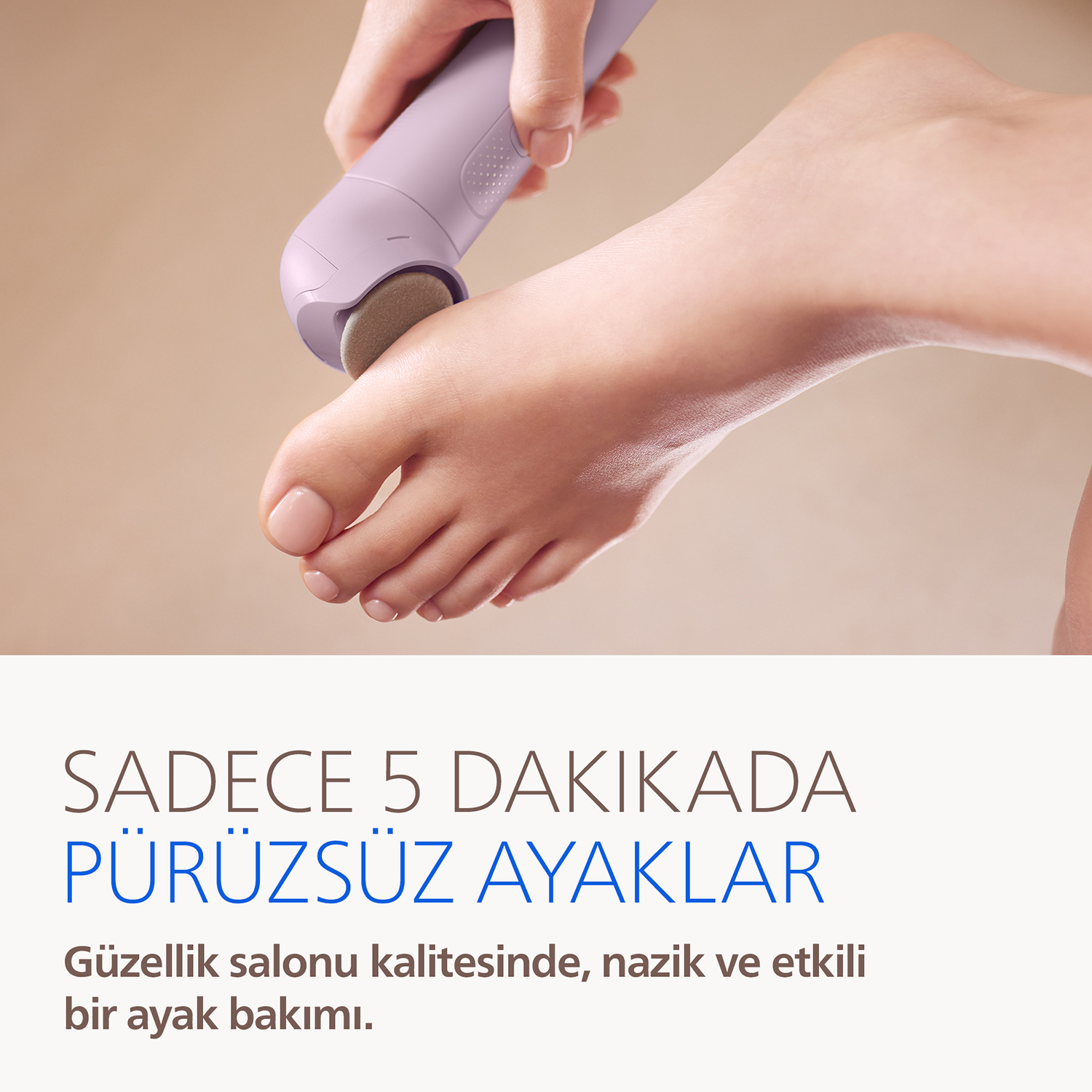 Bir el, bir parmağı törpülemek için mor bir cihaz kullanıyor. Pürüzsüz ayaklar.