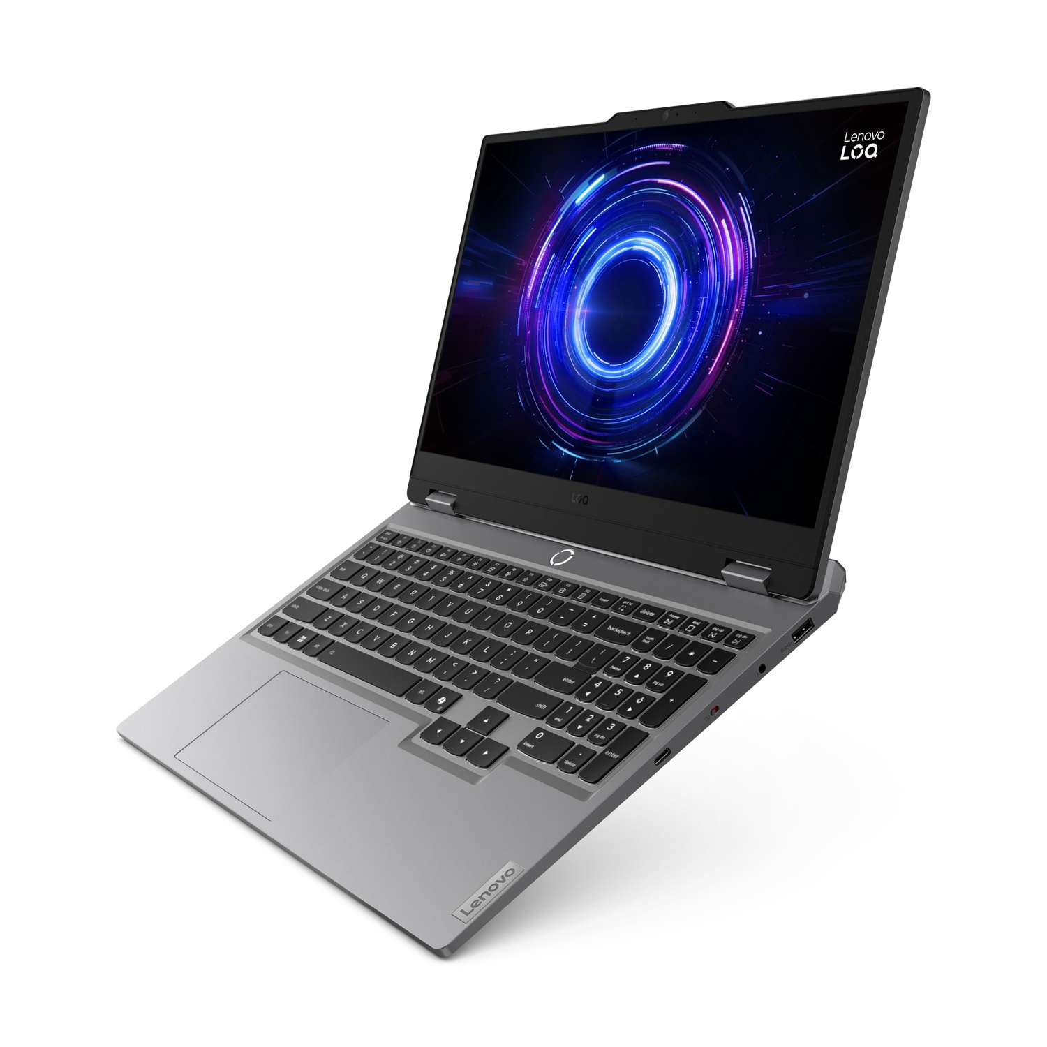 Un laptop Lenovo LOQ grigio con un cerchio concentrico luminoso sullo schermo.