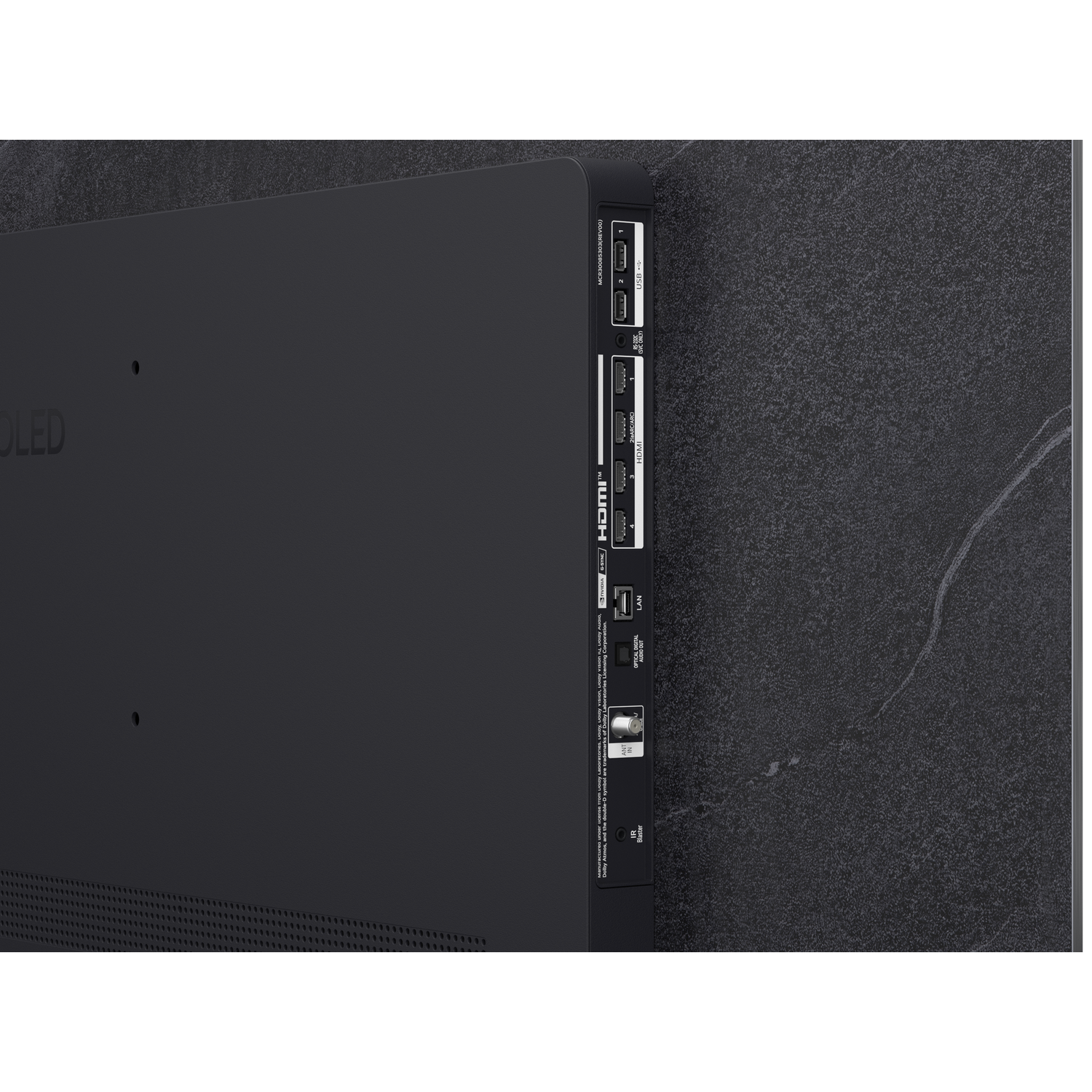 Arrière d'une TV noire montrant les ports : USB, HDMI, LAN, optique.