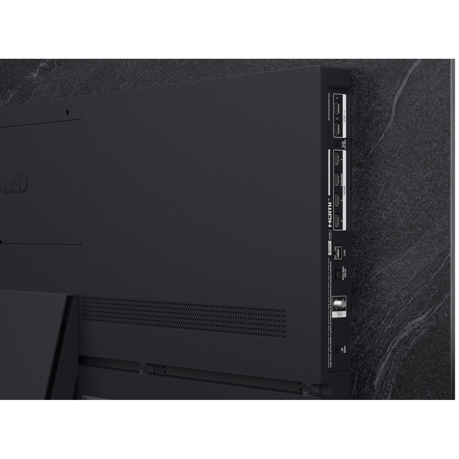 Vue latérale d'un téléviseur noir montrant les ports : HDMI, USB, LAN, optique, antenne, IR.