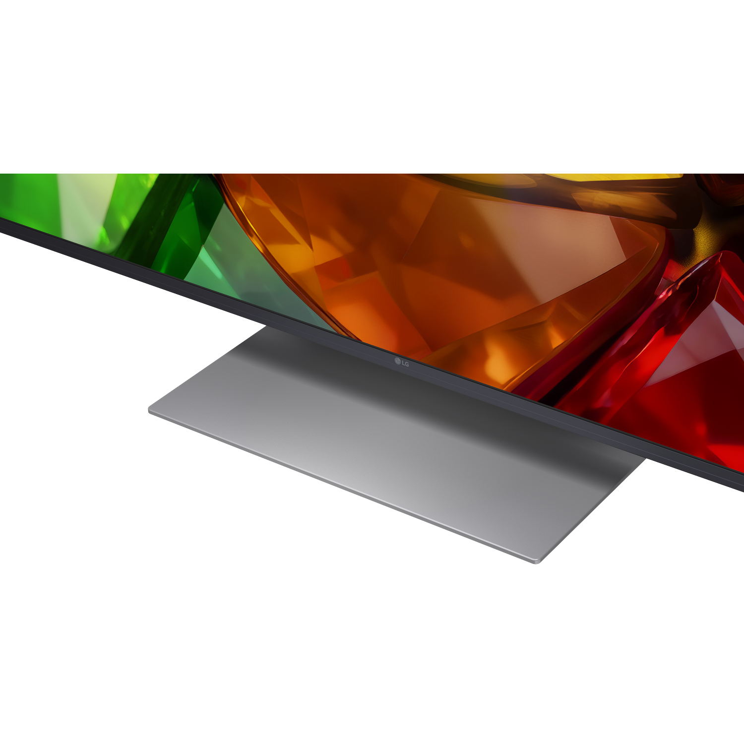 Een moderne televisie met een zilveren standaard en kleurrijke abstracte achtergrond.