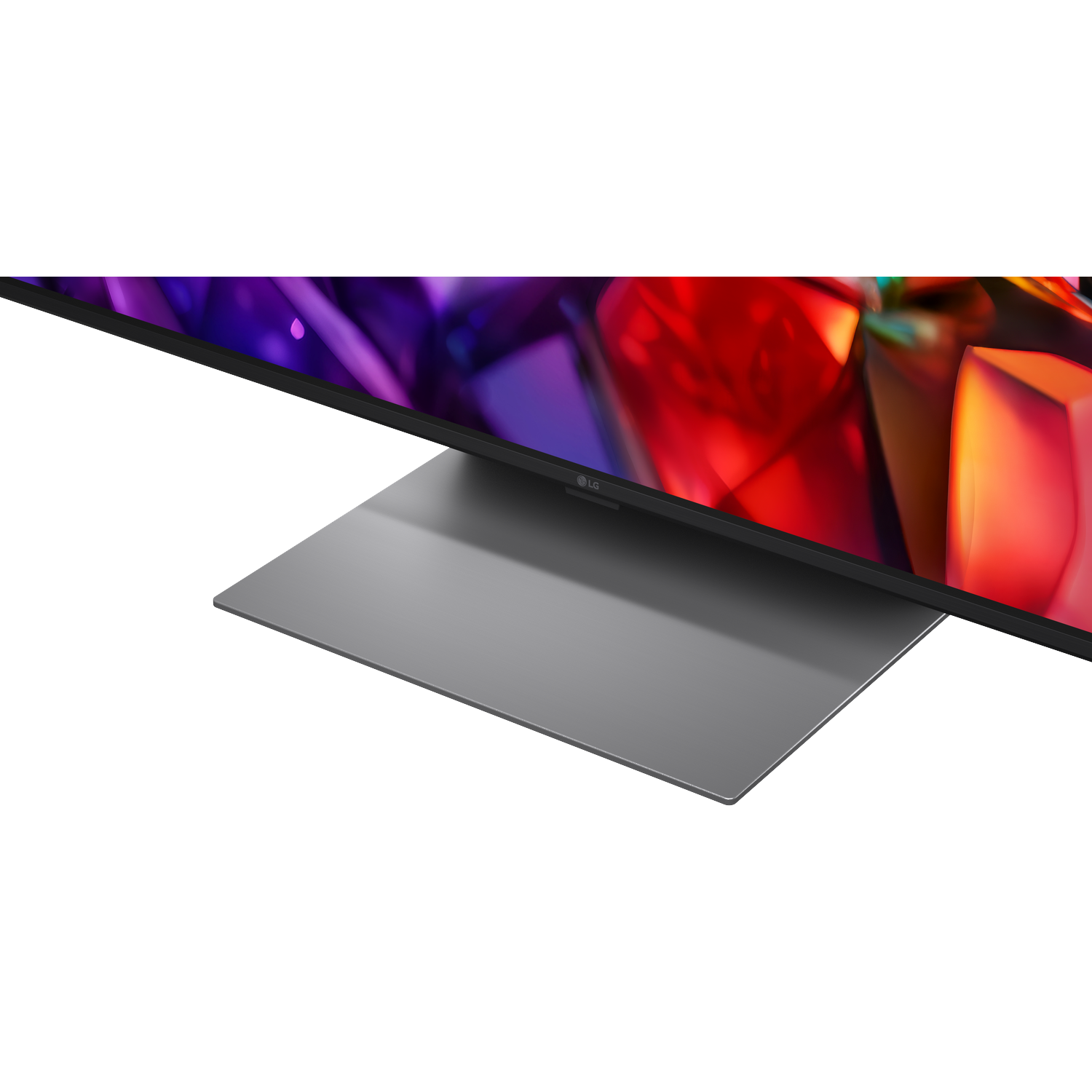 A modern television with a silver stand and colorful screen display.