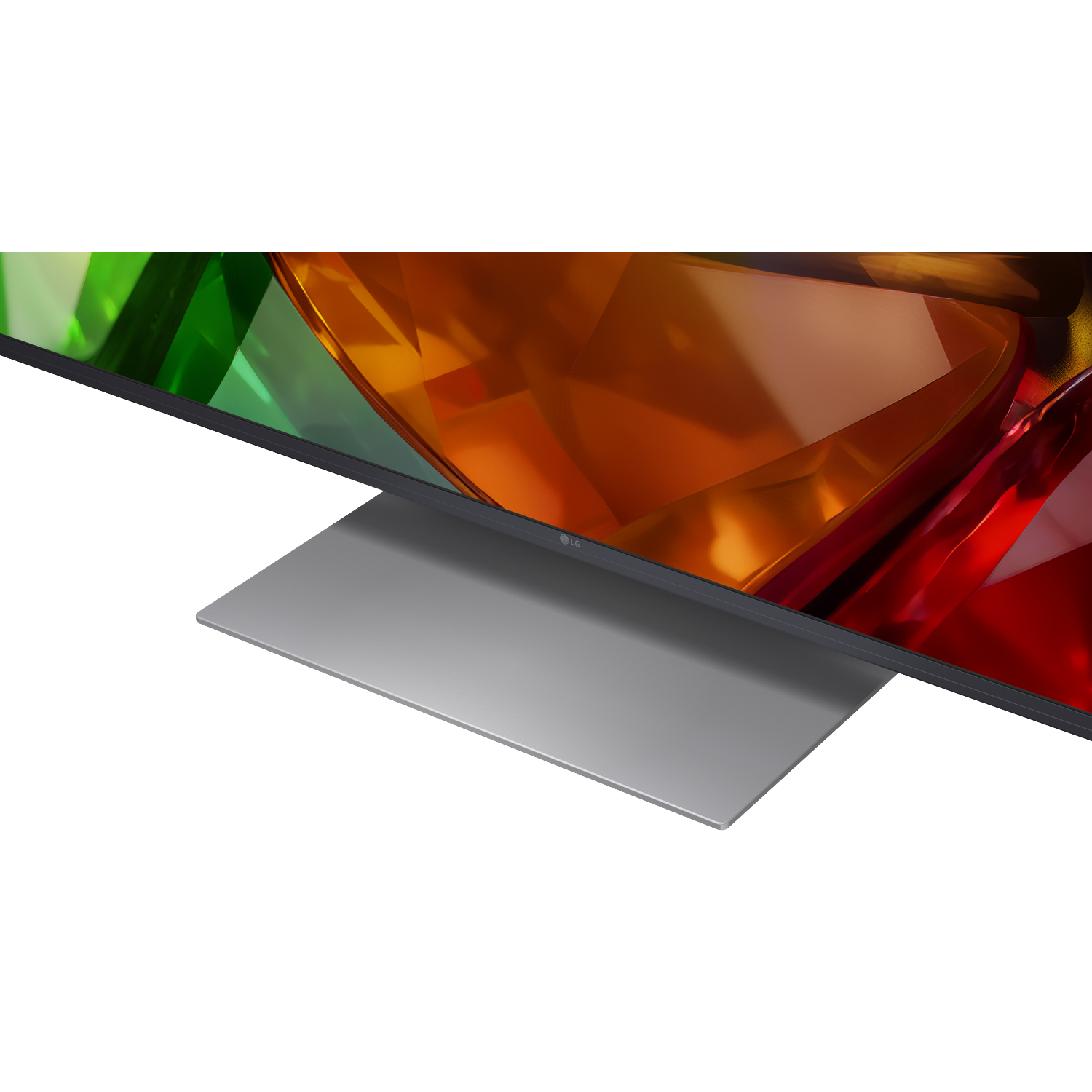Een moderne LG TV met een strakke grijze standaard toont een levendig abstract scherm met rode, oranje en groene vormen.