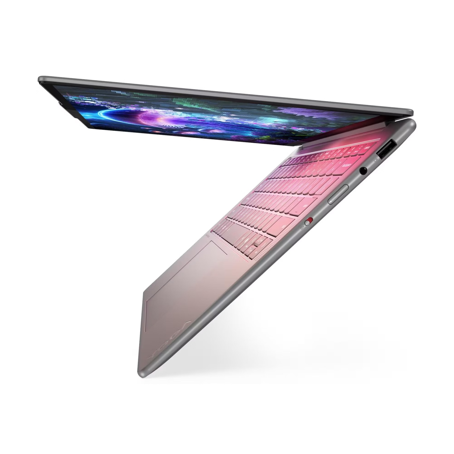 Un laptop argento aperto con tastiera rosa e schermo colorato.