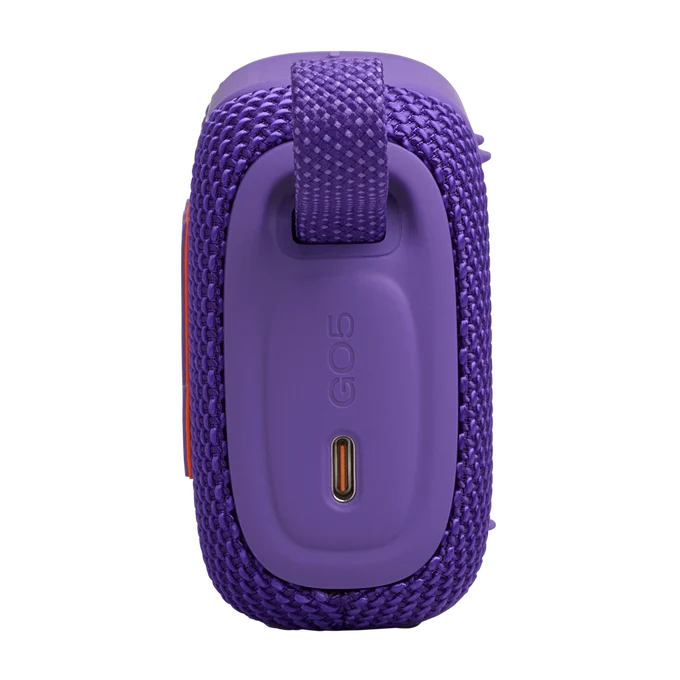 Altavoz portátil morado con puerto de carga y correa.