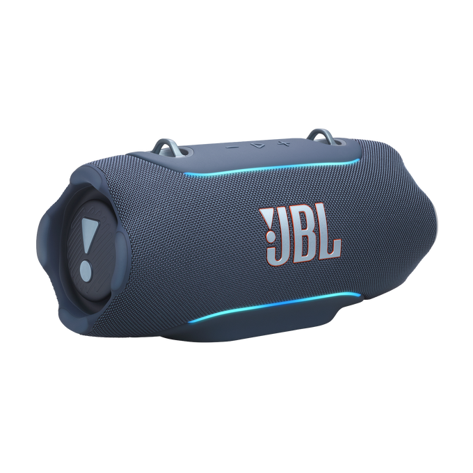 Altavoz JBL gris con detalles y logo azules.
