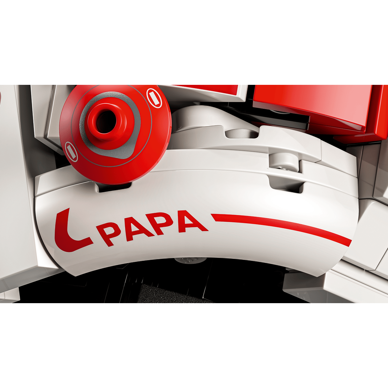 Een wit Lego-element met rode stickers met "PAPA" erop en een rode cirkel met grijze details.
