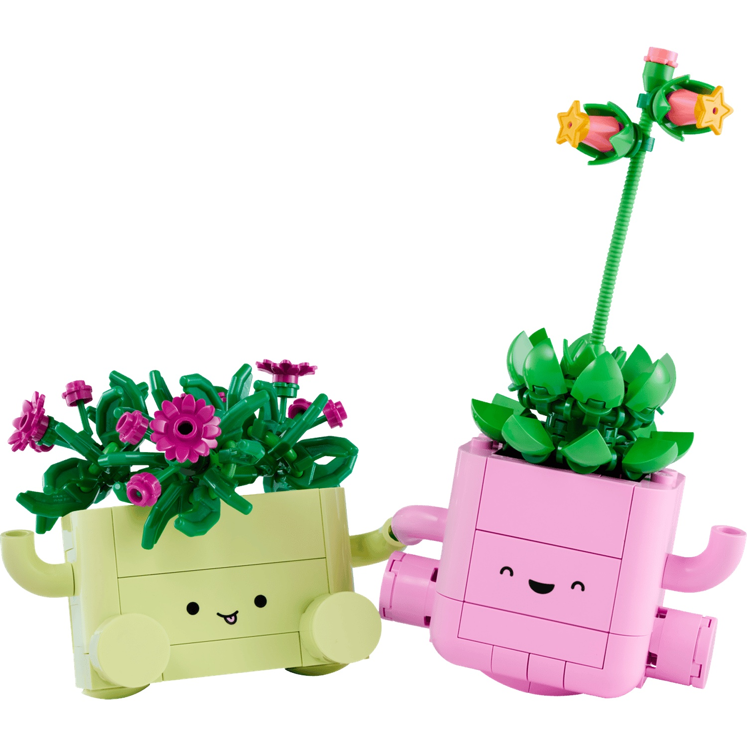 Two Lego planters with faces, one light green with pink flowers, one pink with green leaves.
