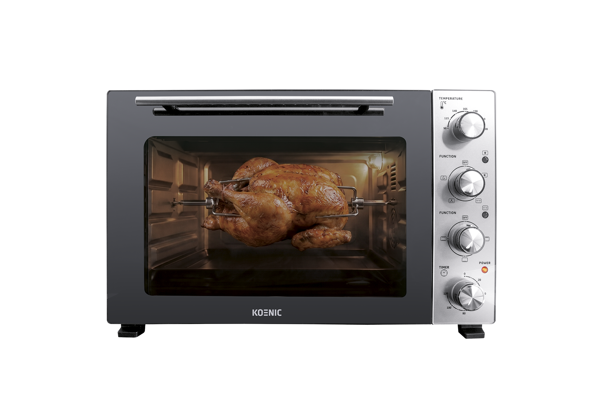 Ein goldbraunes Hähnchen dreht sich in einem Toaster-Ofen auf einem Drehspieß.