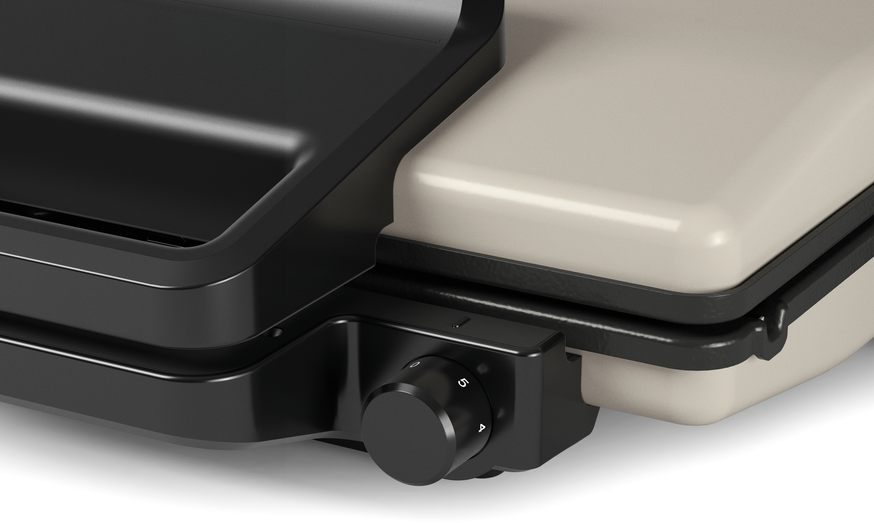 Nahaufnahme eines geschlossenen Kontaktgrills in Schwarz und Beige mit einem Drehregler.