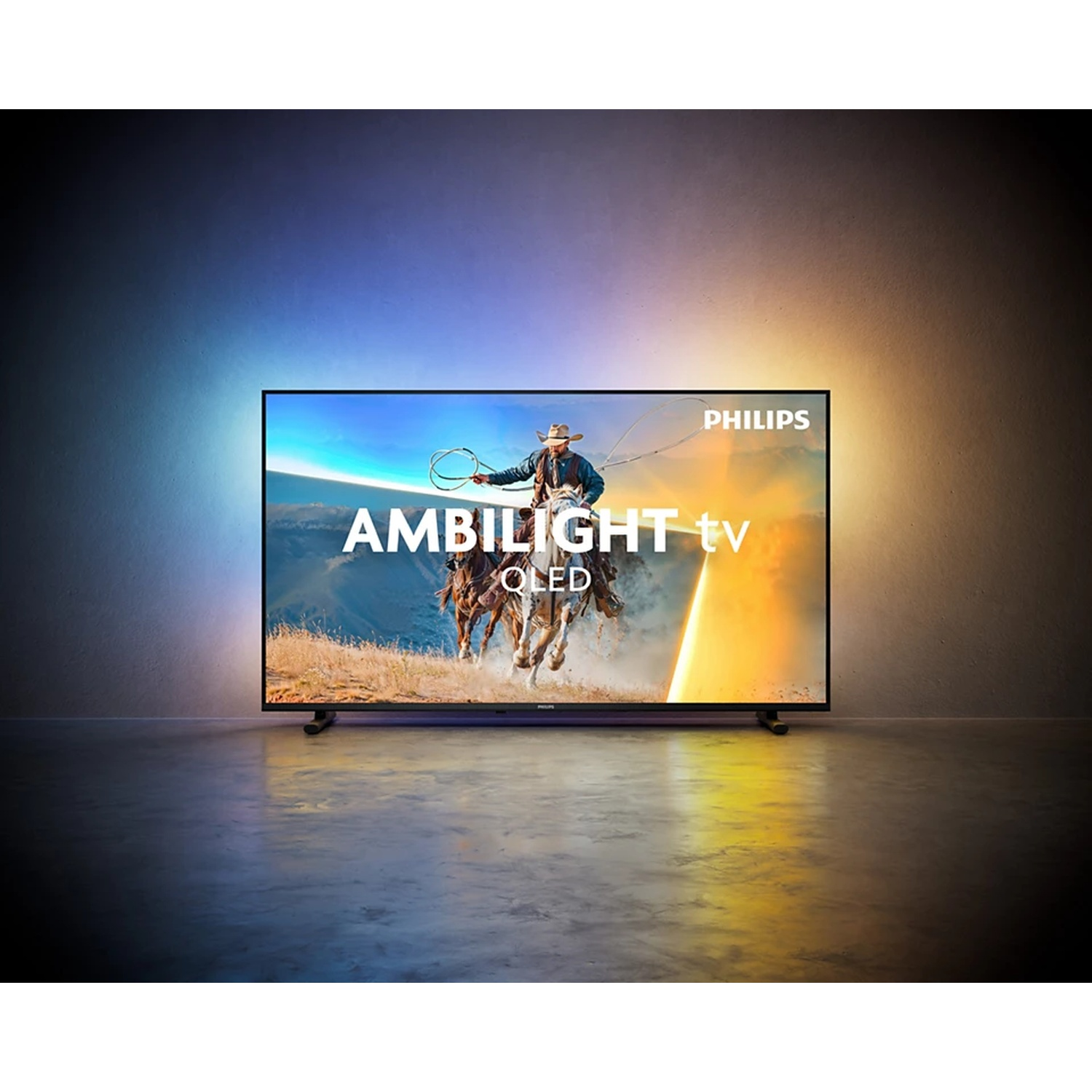 Philips Ambilight TV OLED showing a cowboy on horseback with a lasso, in a desert landscape.