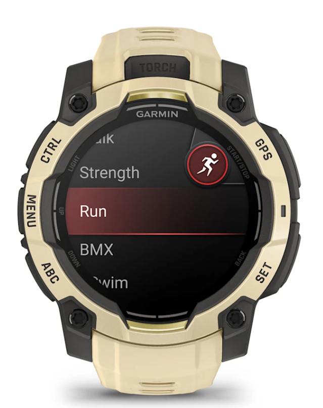 Złoty zegarek Garmin wyświetlający menu aktywności z wybranym bieganiem.
